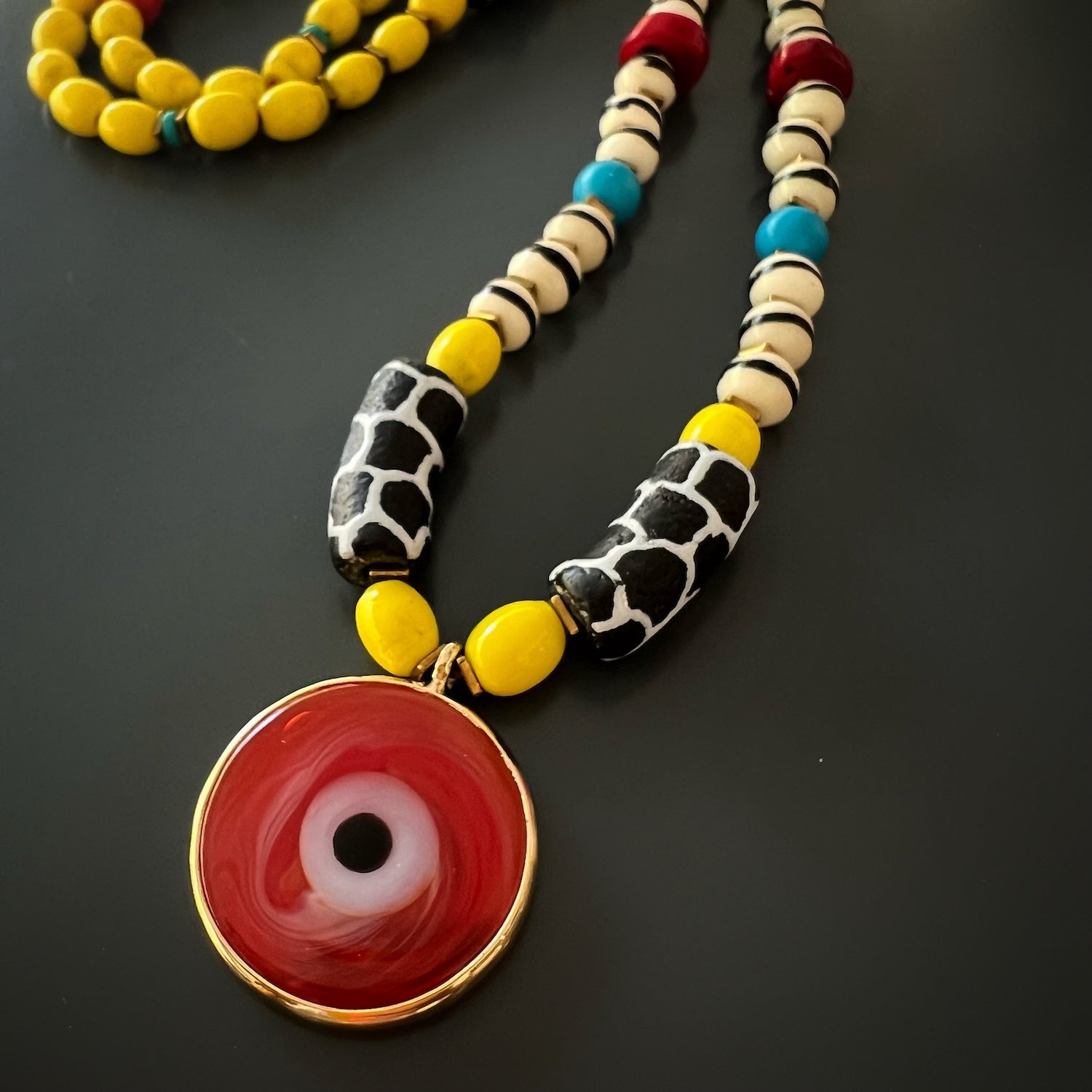 Detailed shot of the turquoise stones used in the African Yellow Happiness Necklace.