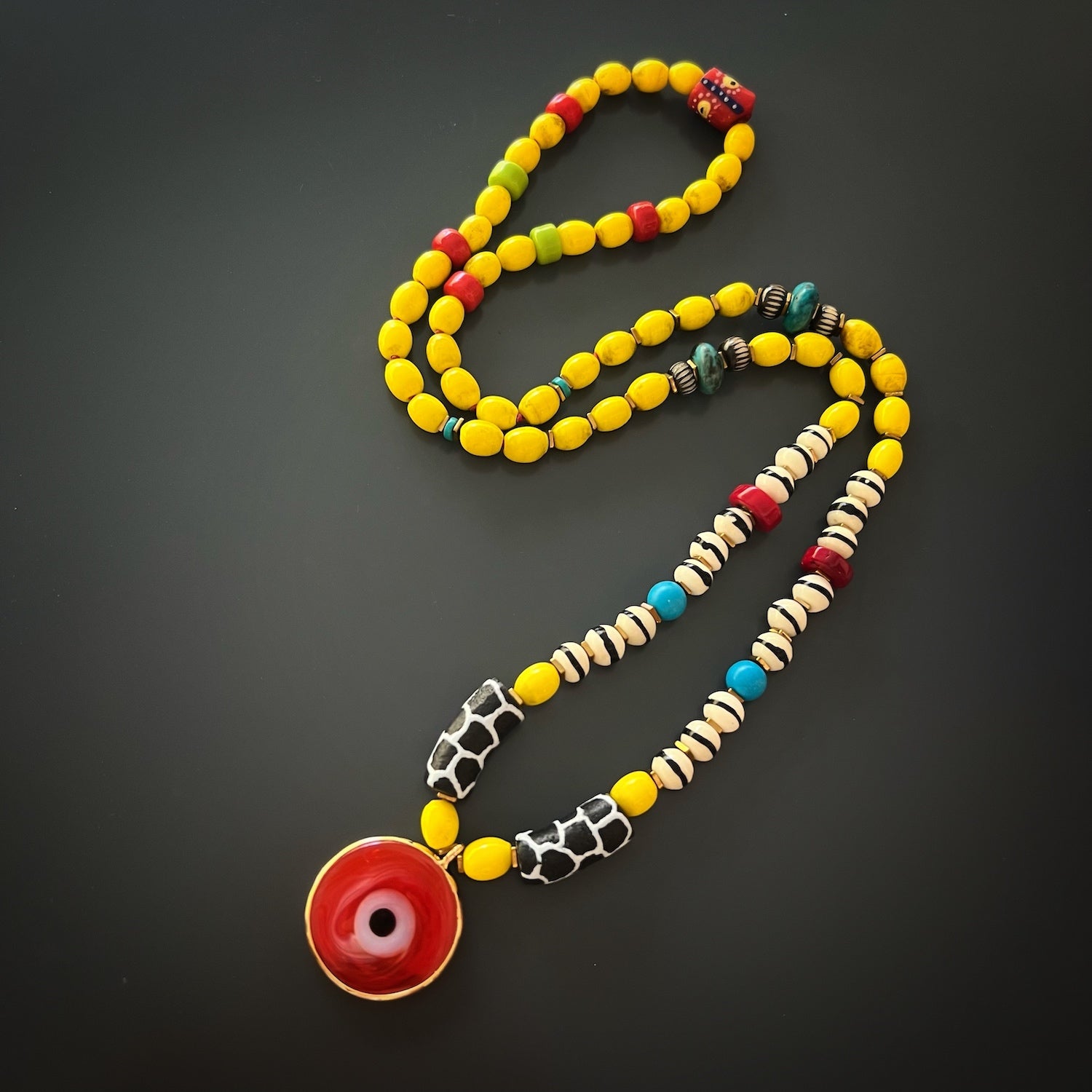 Necklace length of 34&quot; on the African Yellow Happiness Necklace, providing a versatile and stylish accessory.