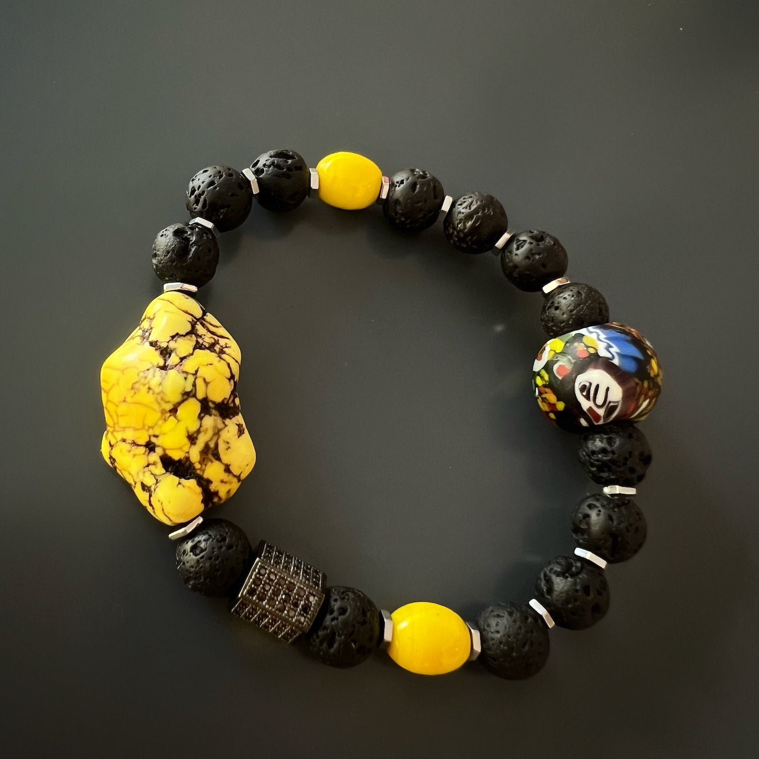 Handmade African bead featured in the African Yellow Turquoise Bracelet, highlighting its intricate design and craftsmanship.