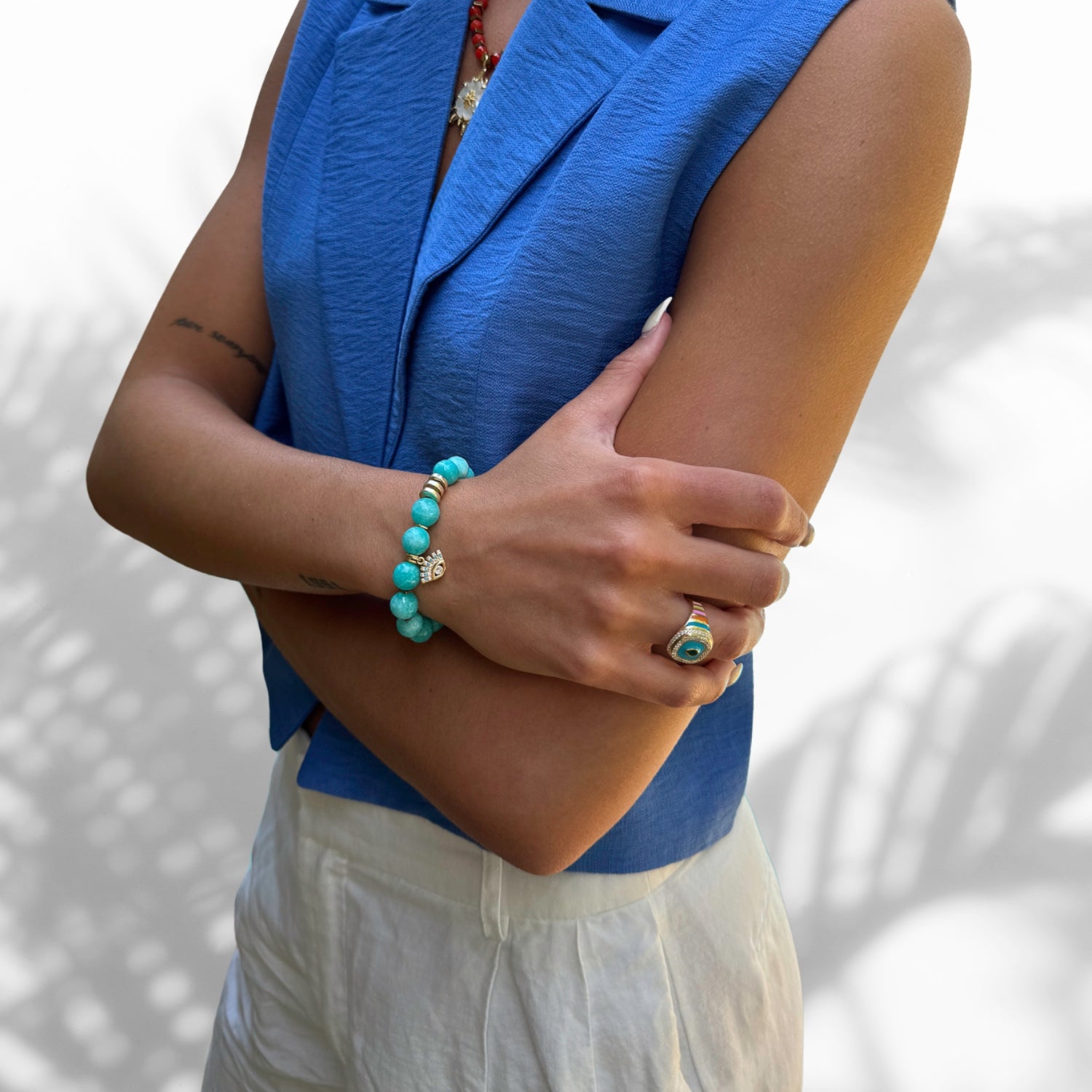 Model Wearing Stylish Beaded Bracelet with Amazonite and Evil Eye Charm