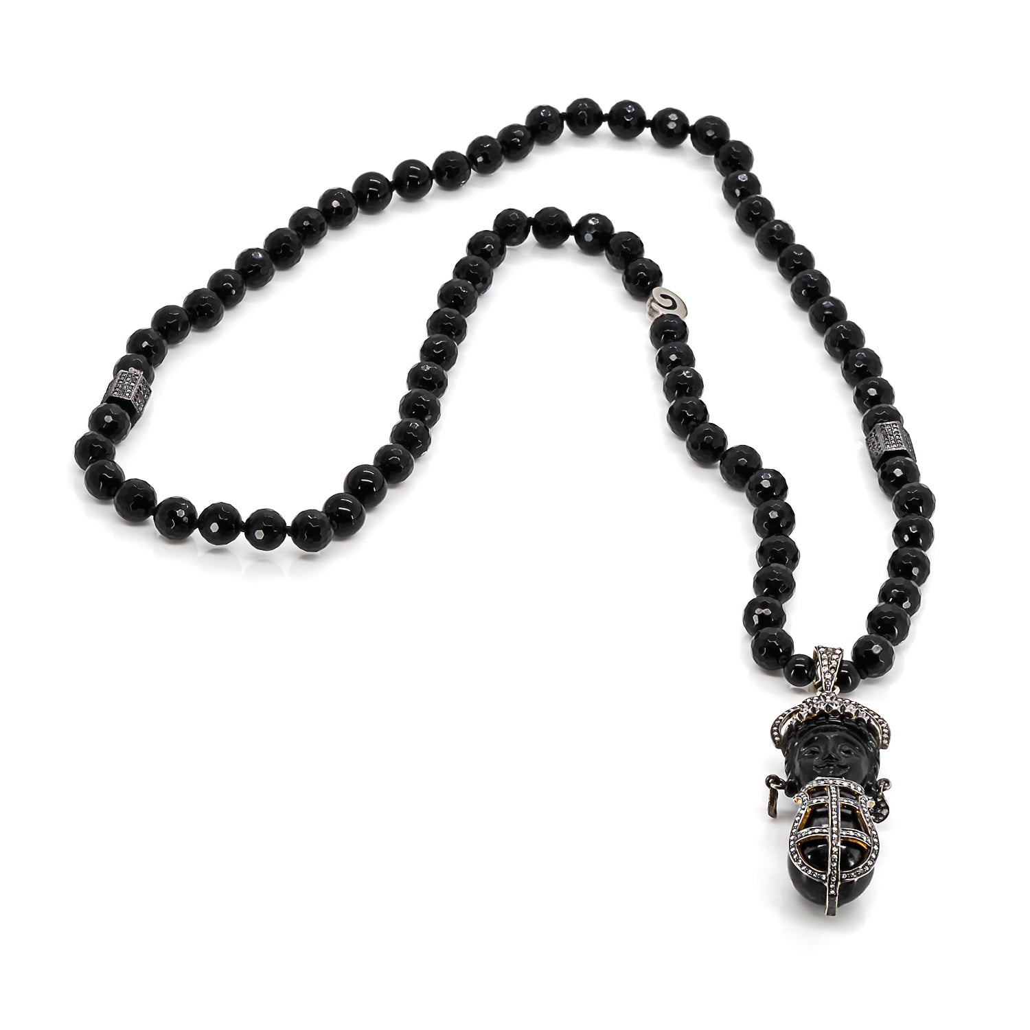 Black onyx stone beaded necklace with a detailed pave diamond pendant, highlighting cultural richness and sophistication