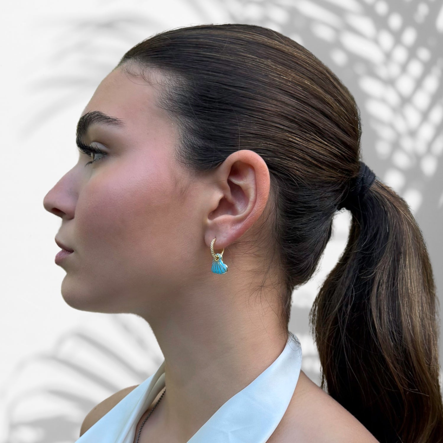 Chic and Glamorous: Model Wearing Blue Enamel Hoop Earrings