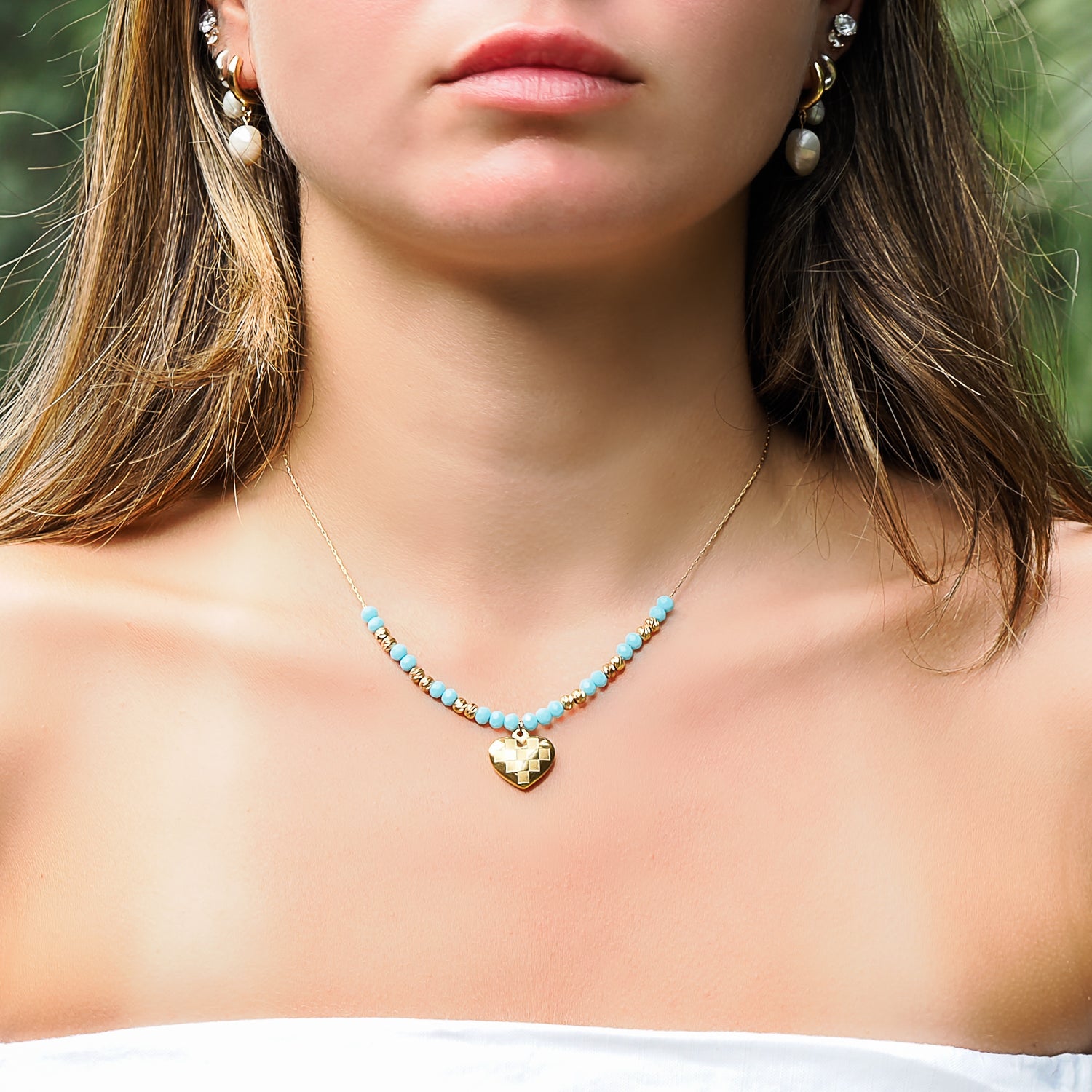 Radiate Serenity - Model Wearing Blue Crystal Heart Necklace.