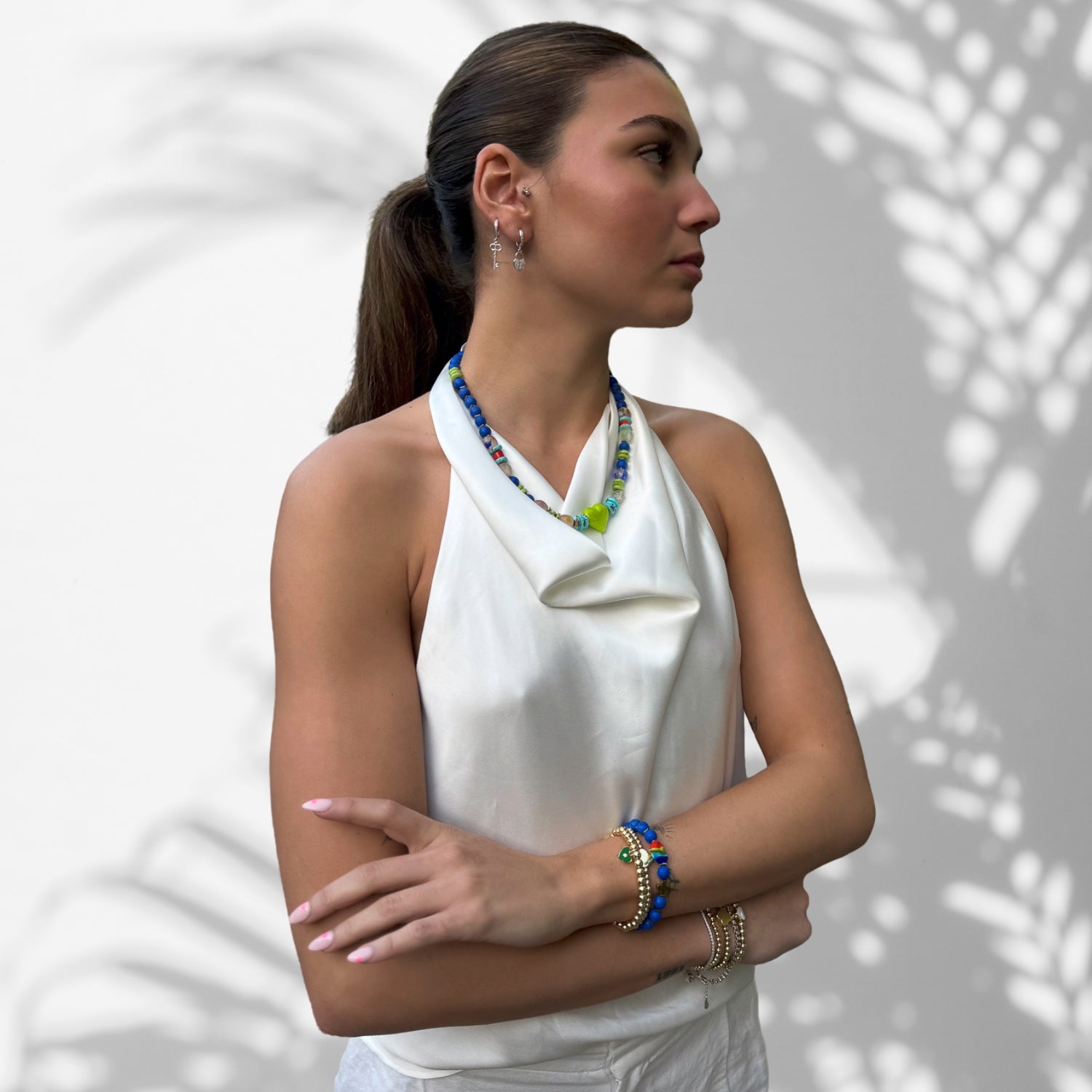 Harmony of Cultures: Model Wearing a Green Ceramic Heart Boho Necklace