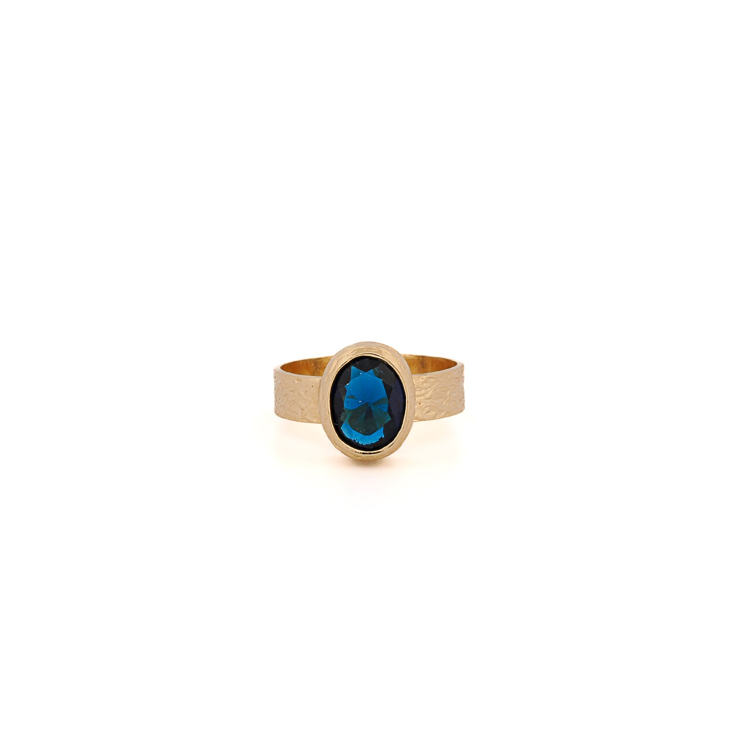 handcrafted ring with deep blue sapphire and warm gold plating