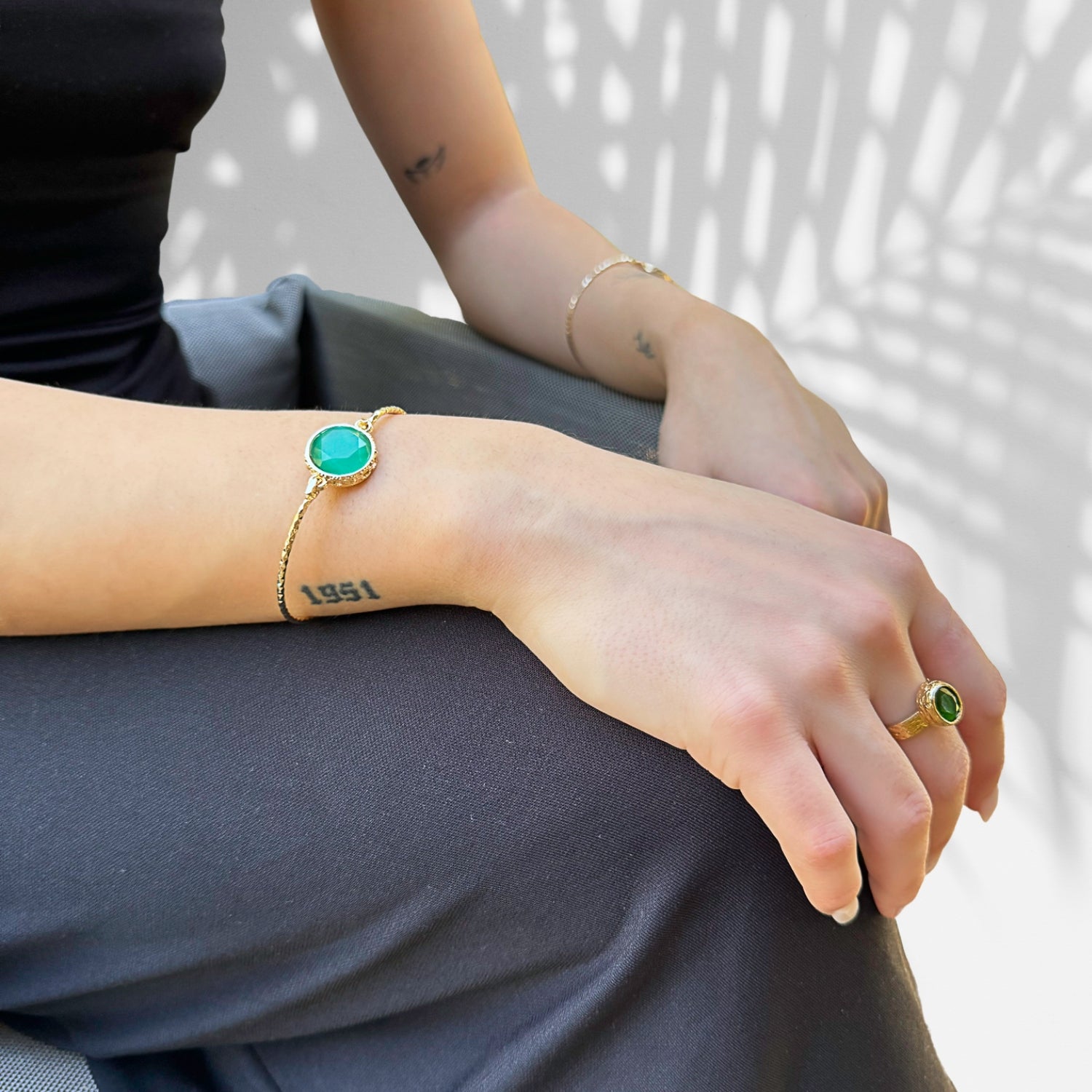 Elegant adjustable ring featuring green jade gemstone and gold band