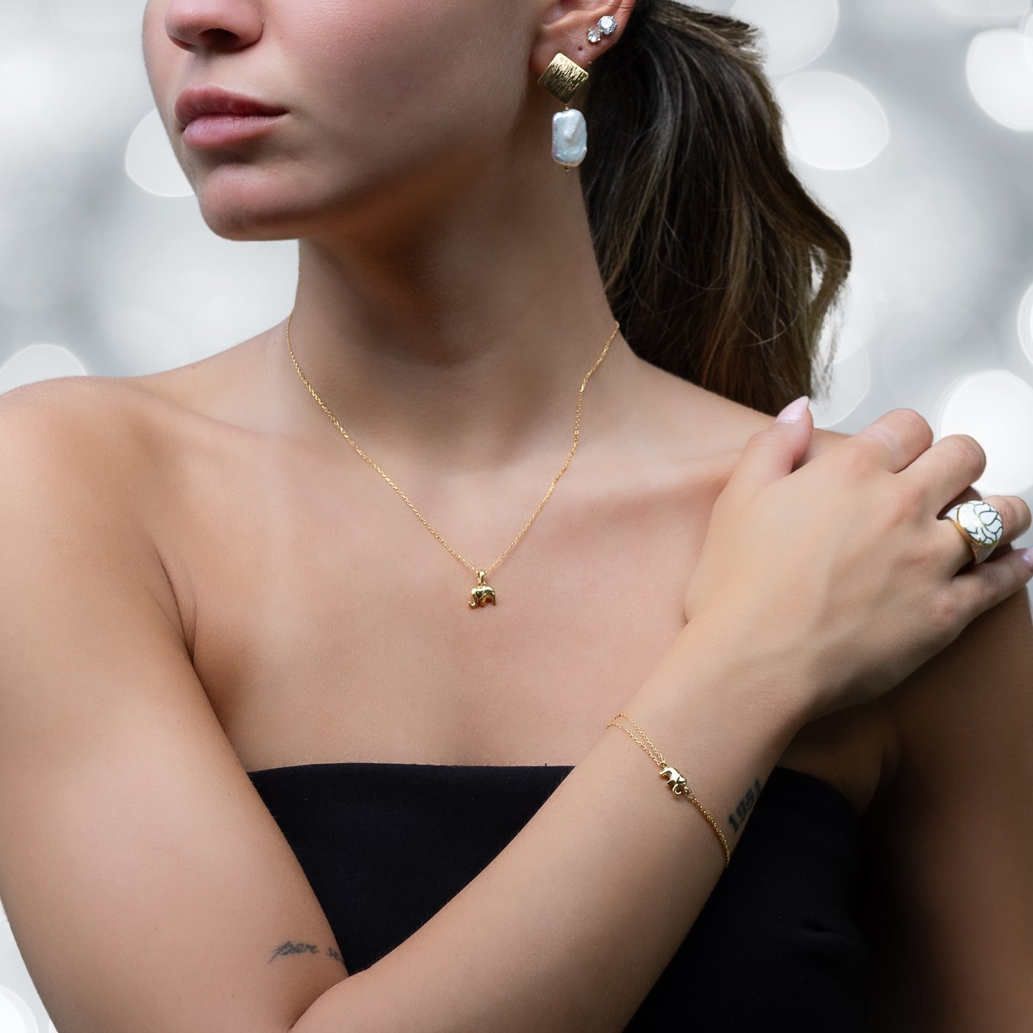 Modern Sophistication: Model in Cleopatra Earrings, 18K Gold Plated.