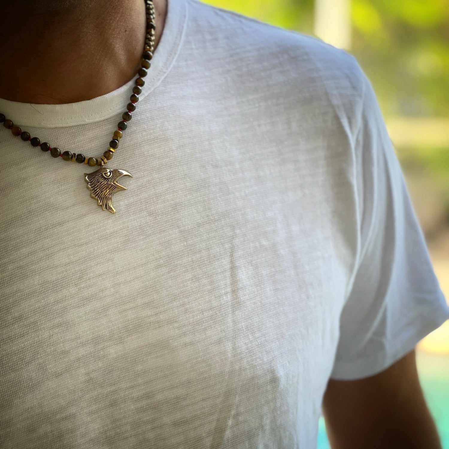 Tiger's Eye beaded men's necklace with handmade bronze eagle pendant and gold hematite accents.