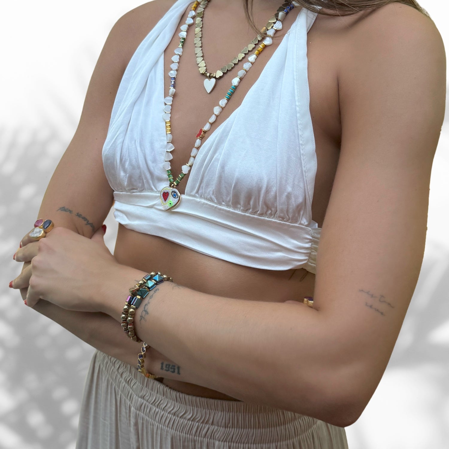 Model Wearing Colorful and Gold Hematite Beaded Bracelet Set with Evil Eye Charm