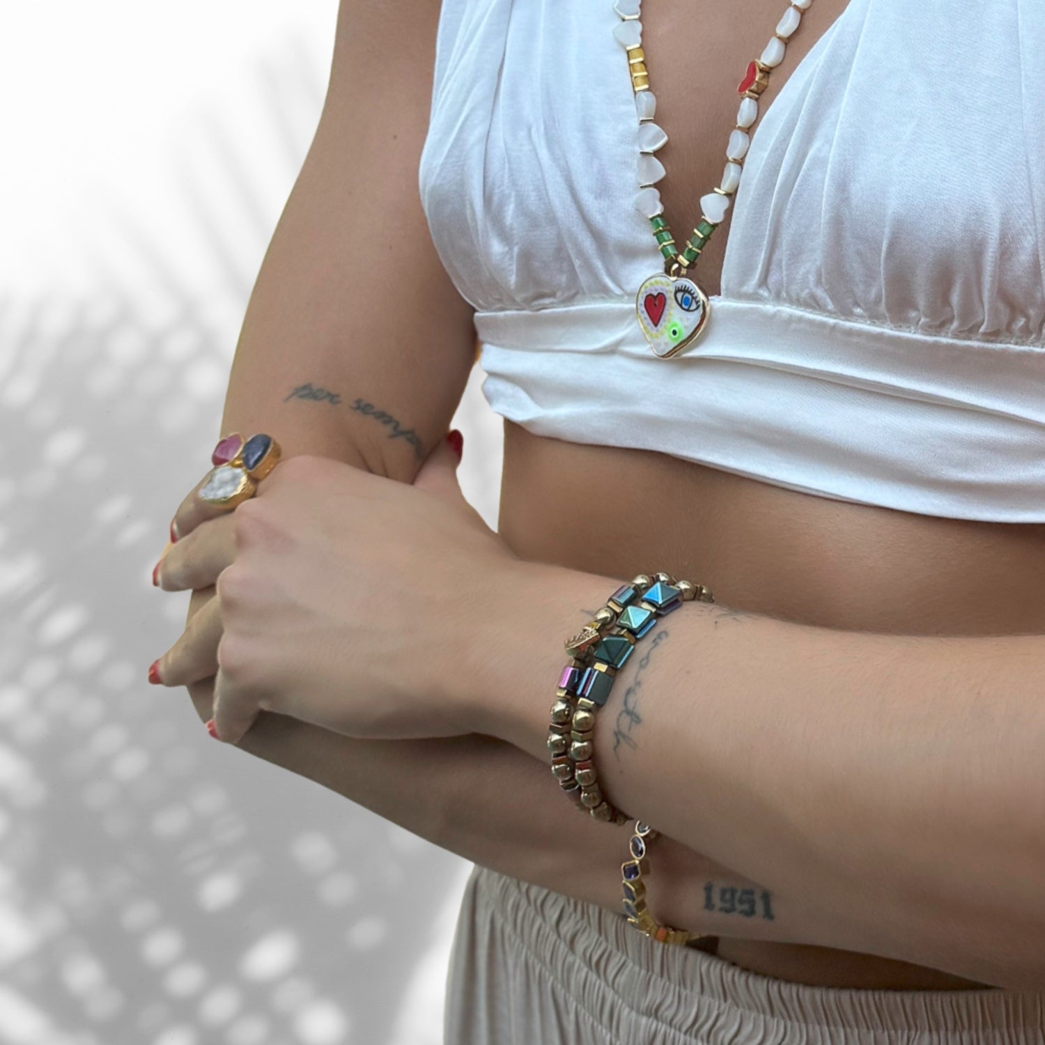 Model Wearing Handcrafted Hematite Beaded Bracelet Set with Gold Charm