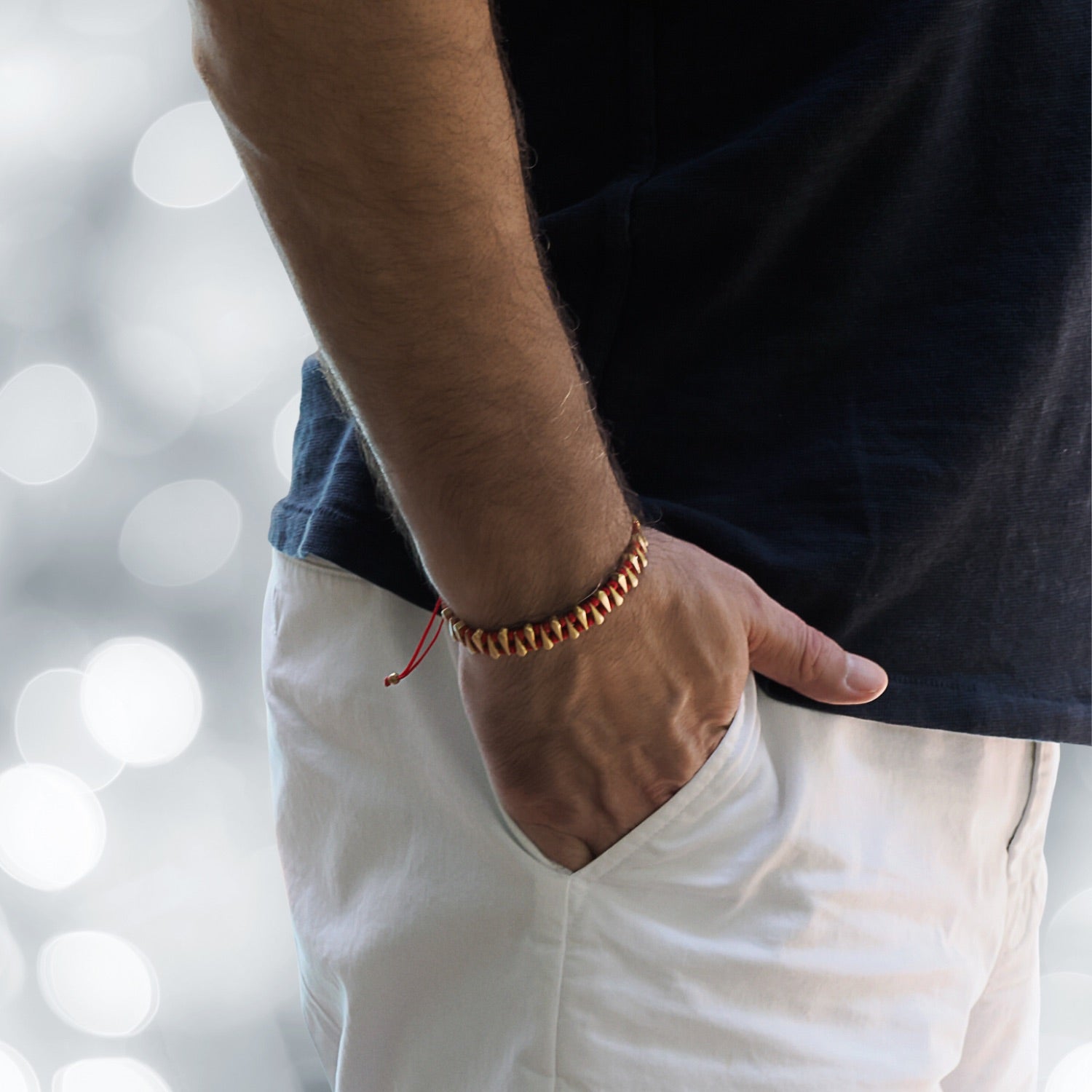 Model Displaying Adjustable Red Bracelet - 24K Gold Plated Details