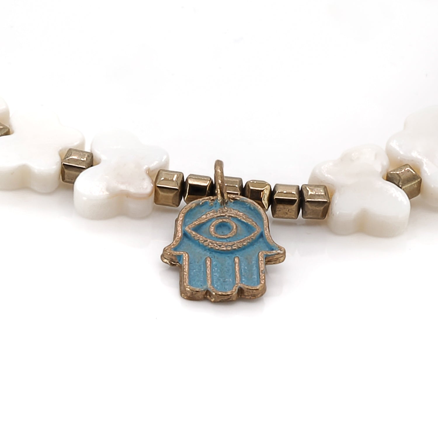 Gold and pearl anklet blending transformation and protection symbolism.