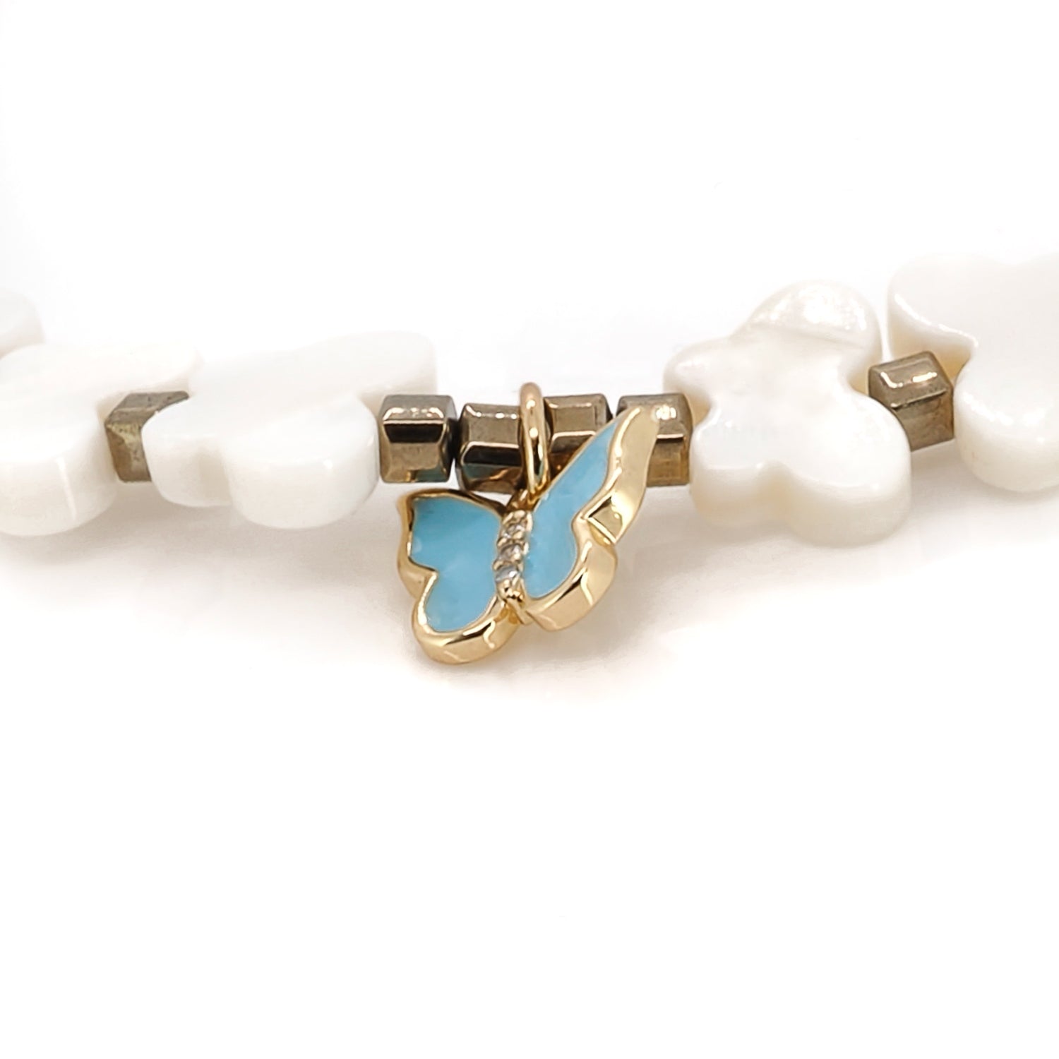 Handmade anklet featuring pearl butterfly beads and spiritual Hamsa charm.