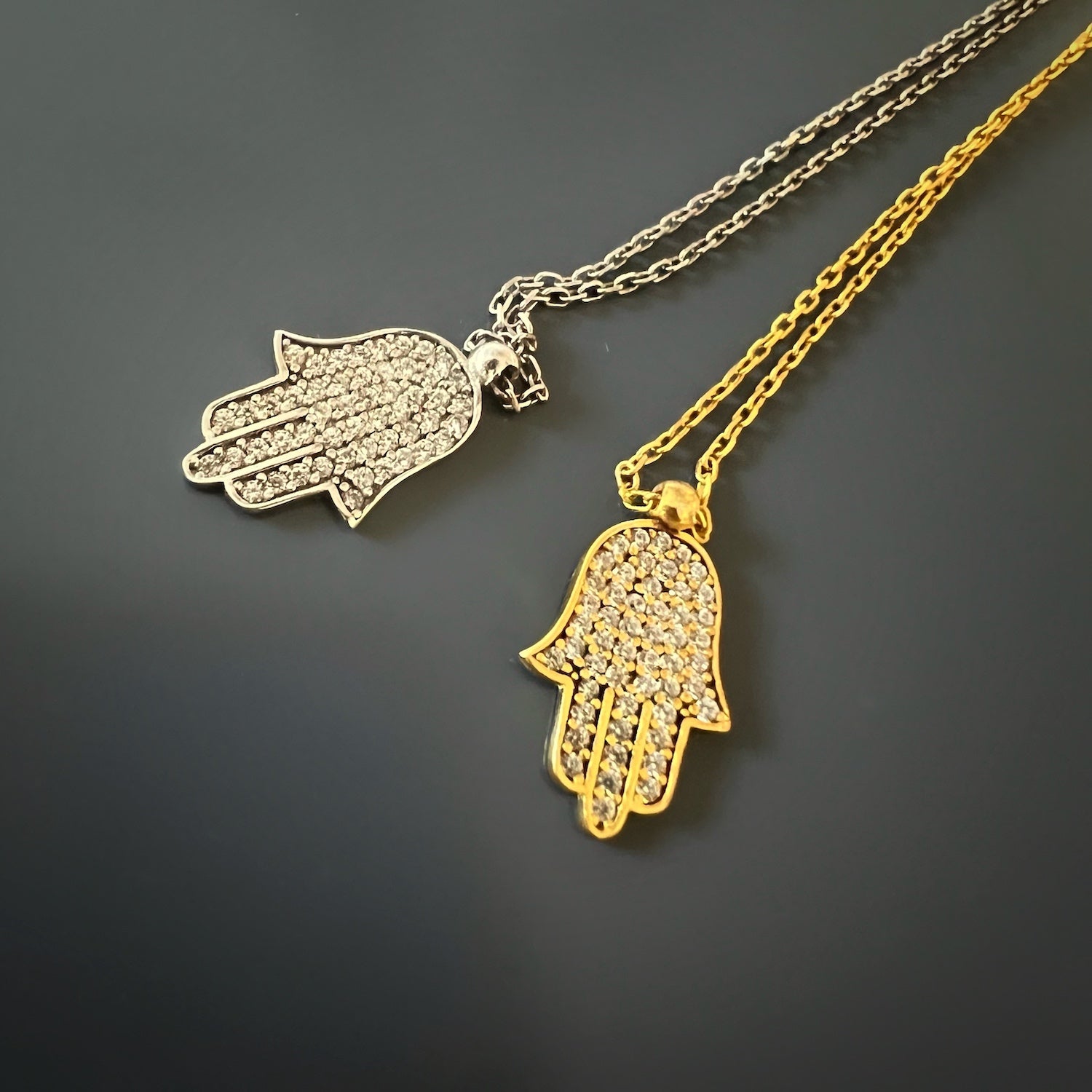 Sterling Silver Hamsa Necklace - Embrace the spiritual power of the Hamsa with this sterling silver necklace, featuring a delicate pendant and zircon stone.