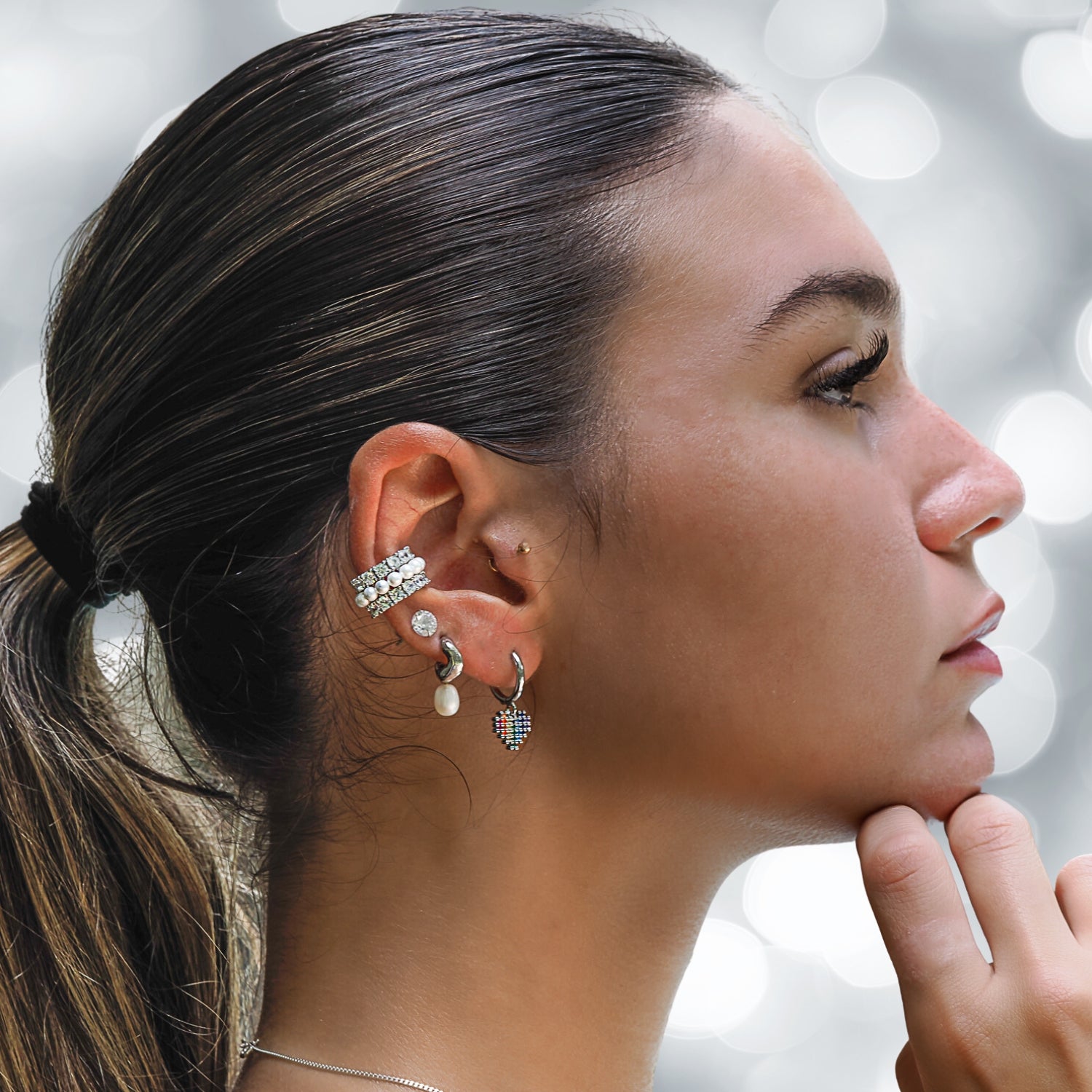 Vibrant heart-shaped earrings featuring multicolor gemstones, plated in 18K white gold