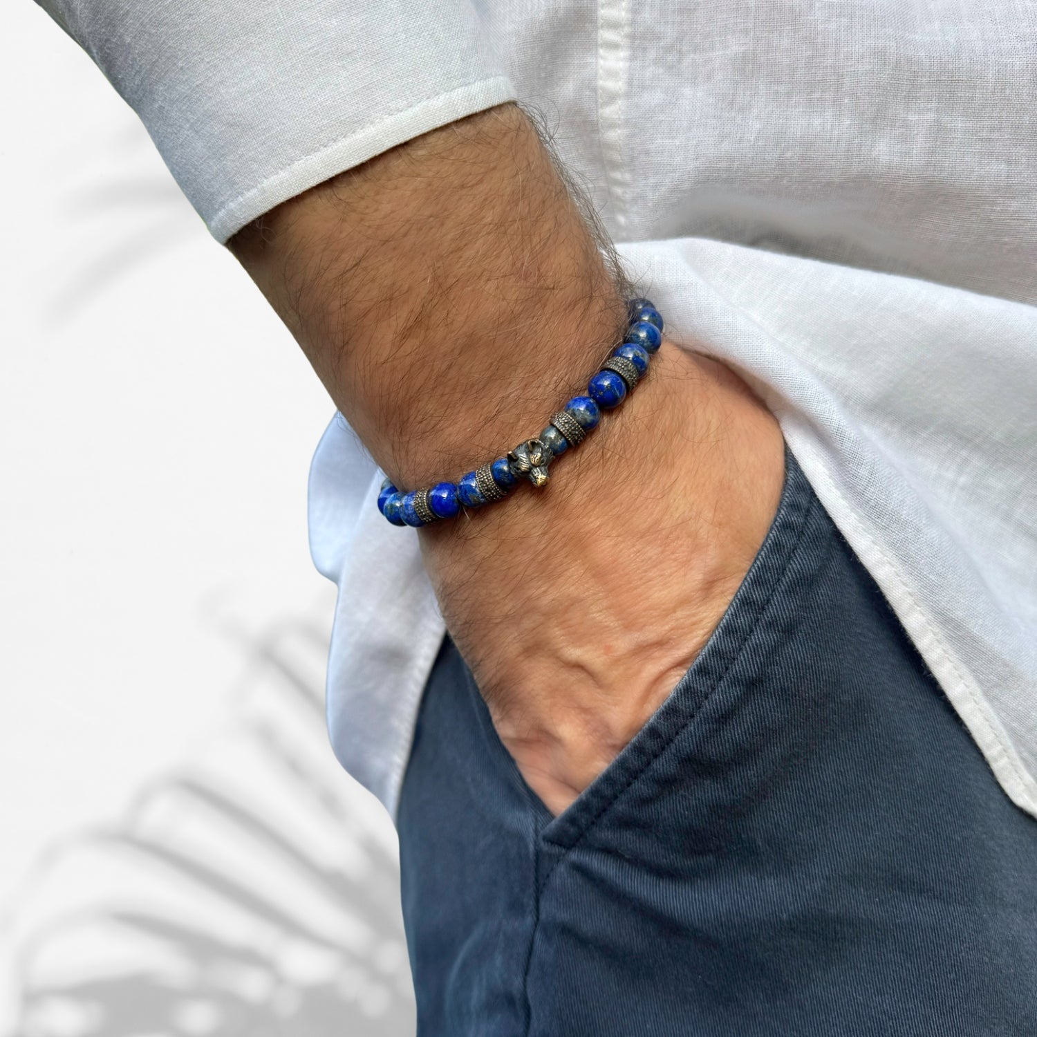 handmade wolf courage bracelet with lapis lazuli stones and bronze beads