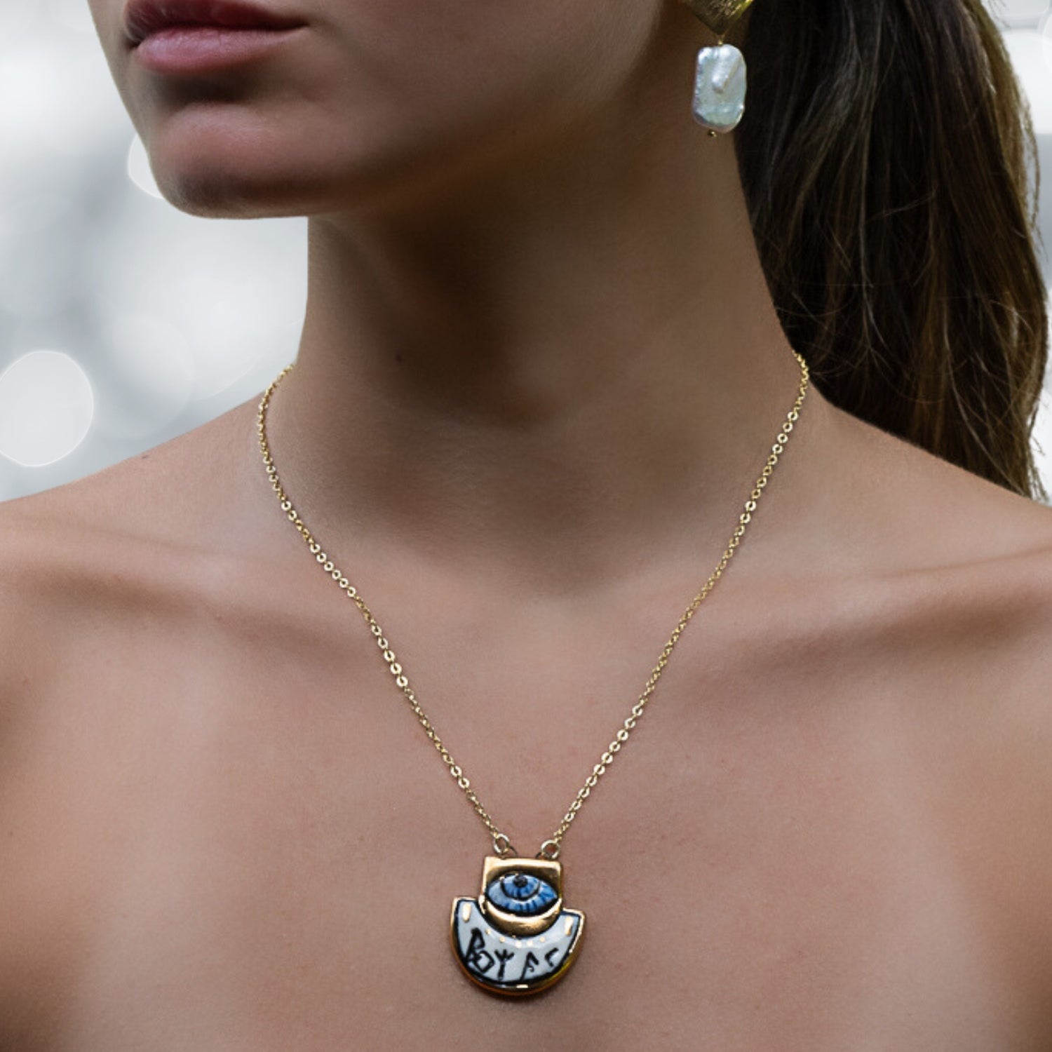 Symbols of Guidance and Protection - The model exemplifies the necklace's talismanic qualities.