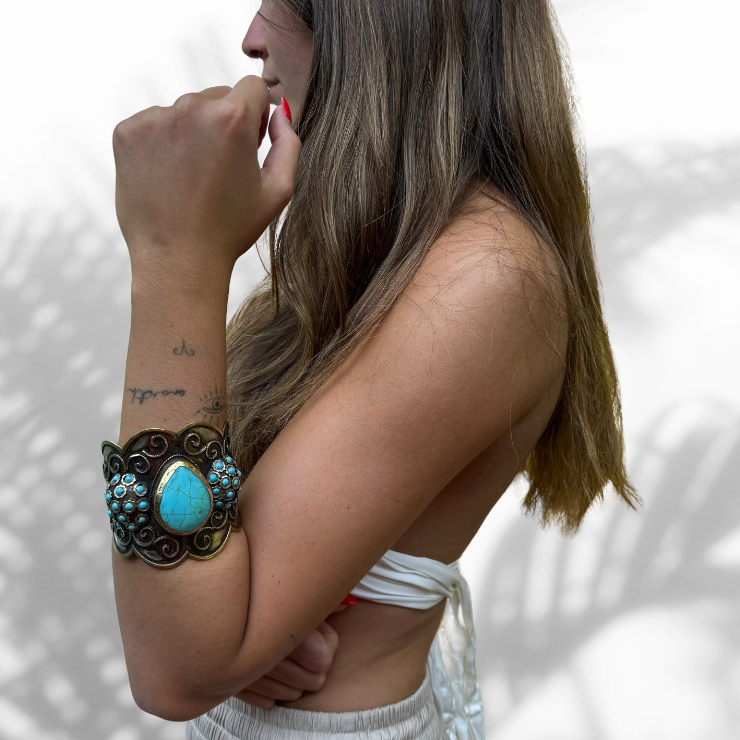 Model Wearing elegant and mystic turquoise gemstone bracelet with vintage silver