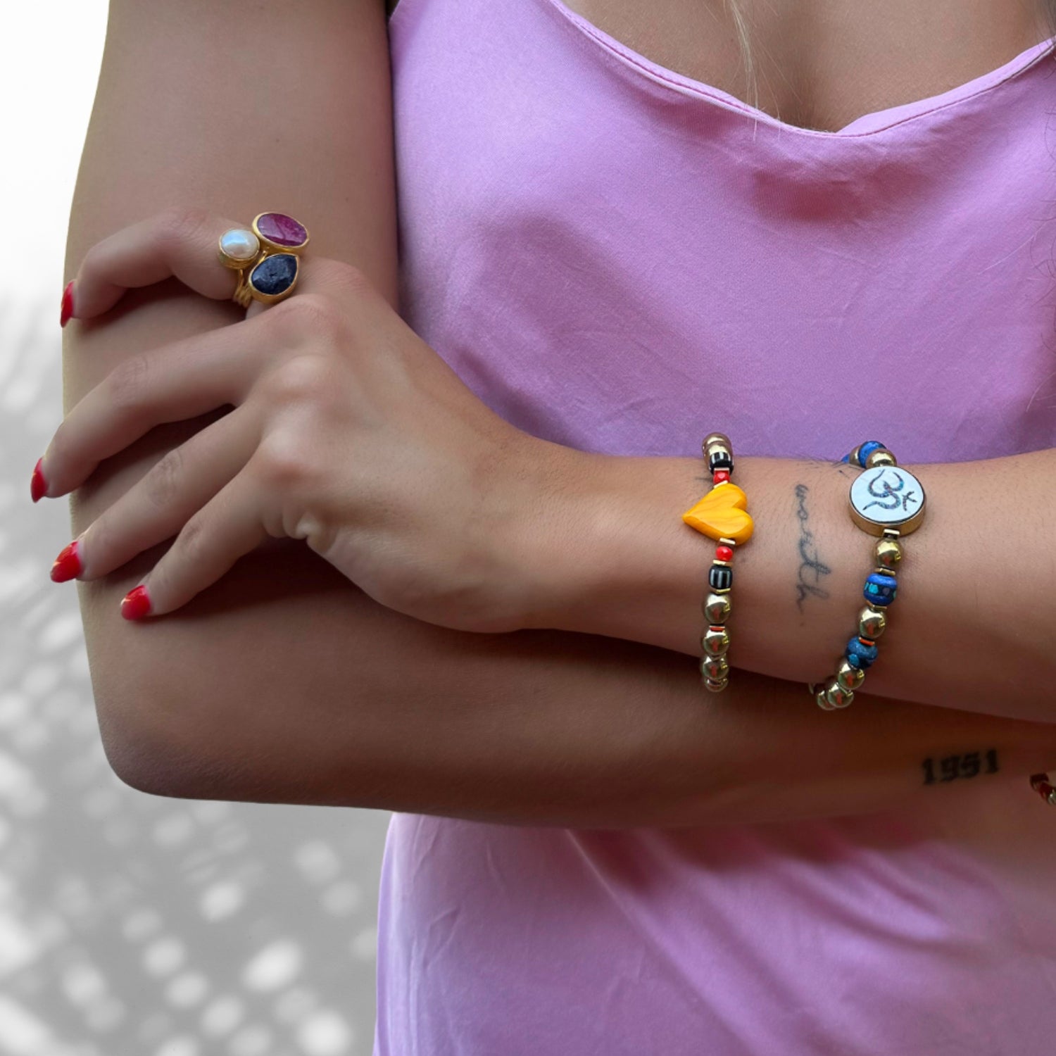 Model Wearing Handmade Bracelet with Murano Glass Yellow Heart and Hematite Stones