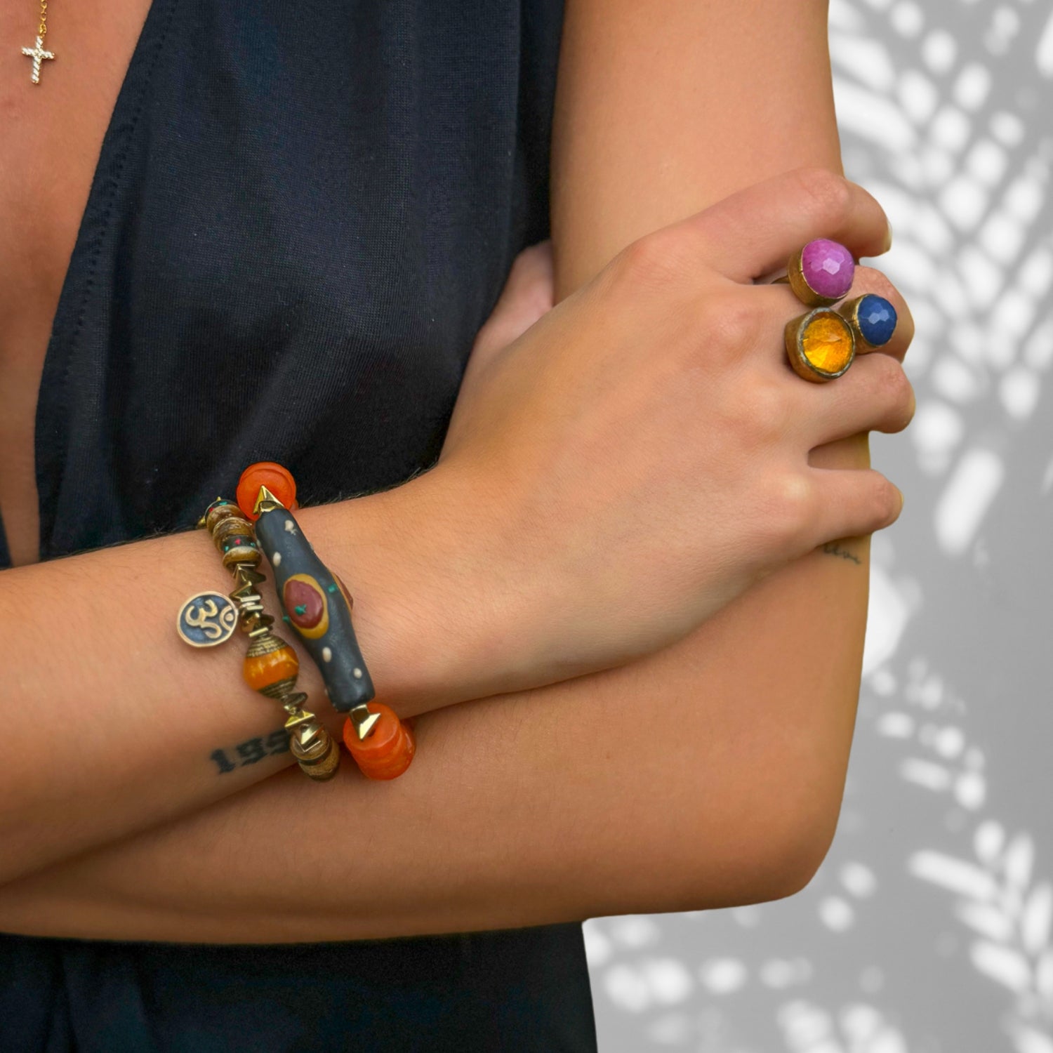 Handmade bracelet duo featuring bronze Om charm, Nepal tube bead, and tree of life accents