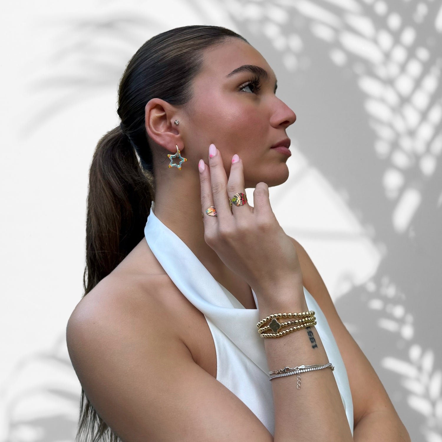 Spread joy: Model donning the Gold Earrings with Cz Diamonds