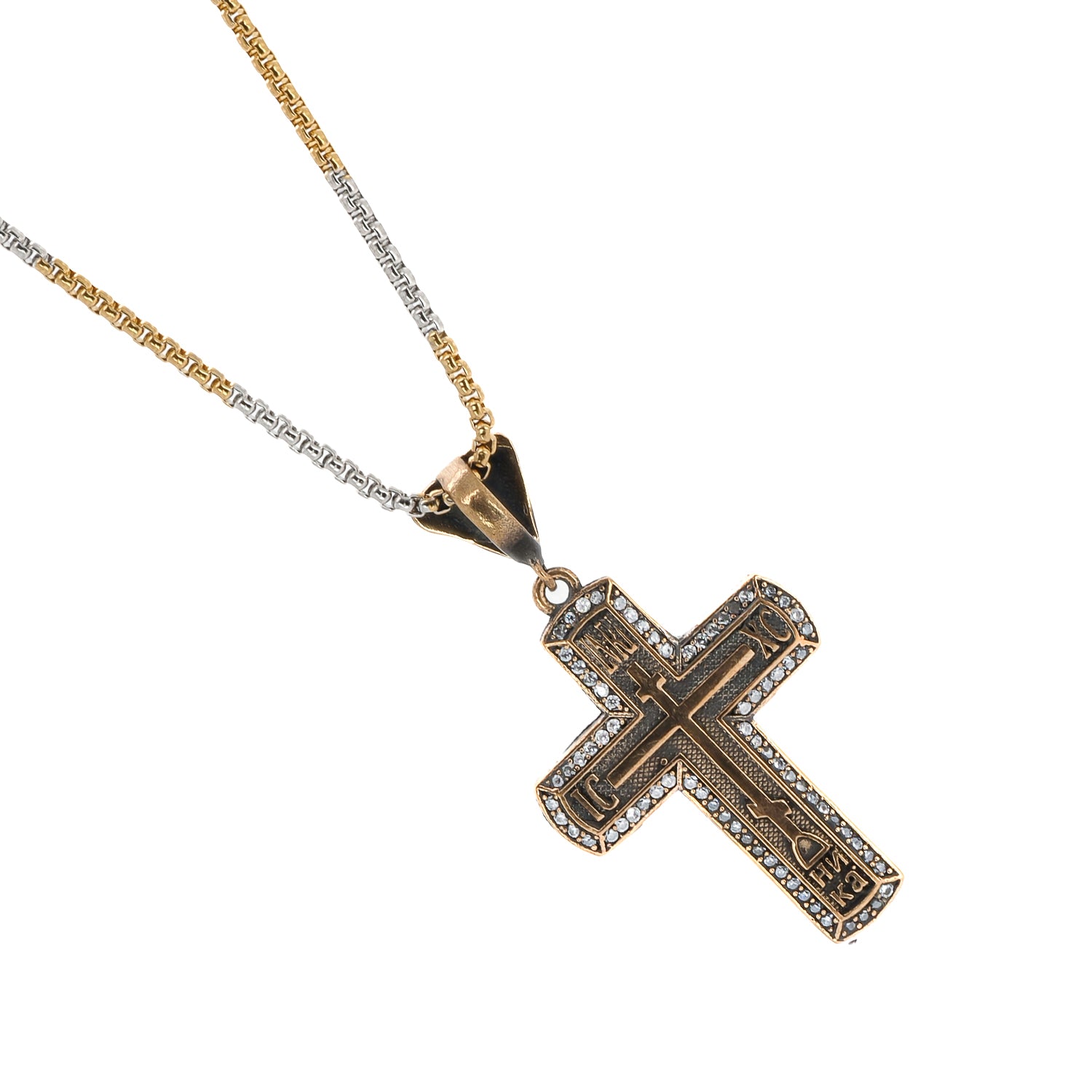 Radiant sterling silver necklace with a gold cross pendant adorned with pave diamonds