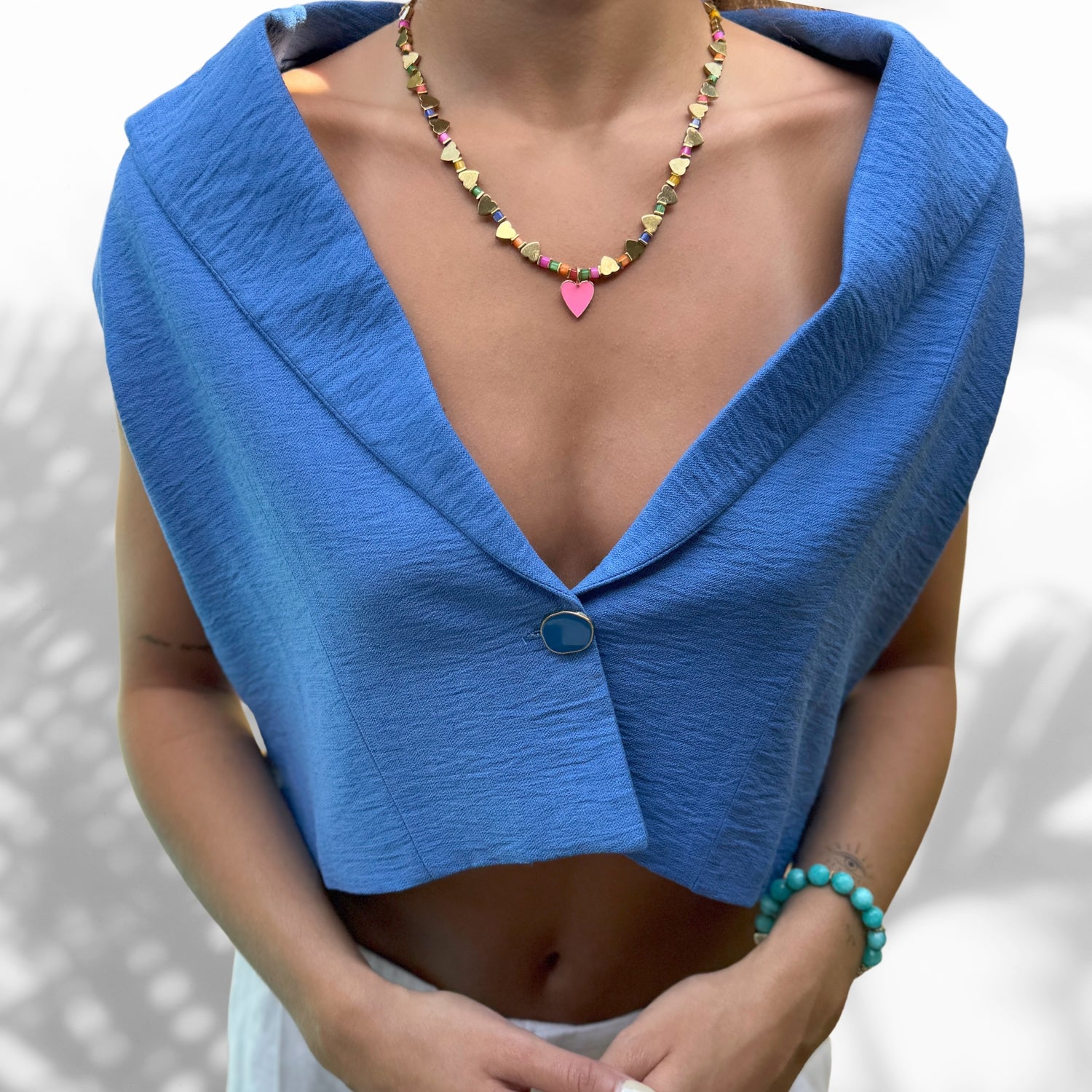 Model Wearing Elegant Pink Heart Pendant Necklace with Gold Hematite and Pearl Beads