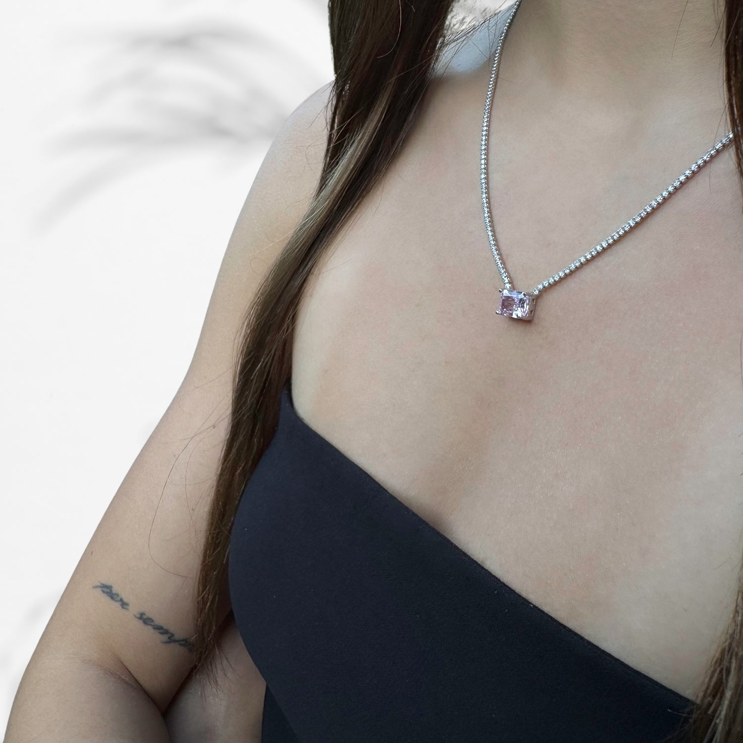 Model Wearing Luxurious Treat: Sterling Silver Necklace with Diamond Chain and Pink Quartz