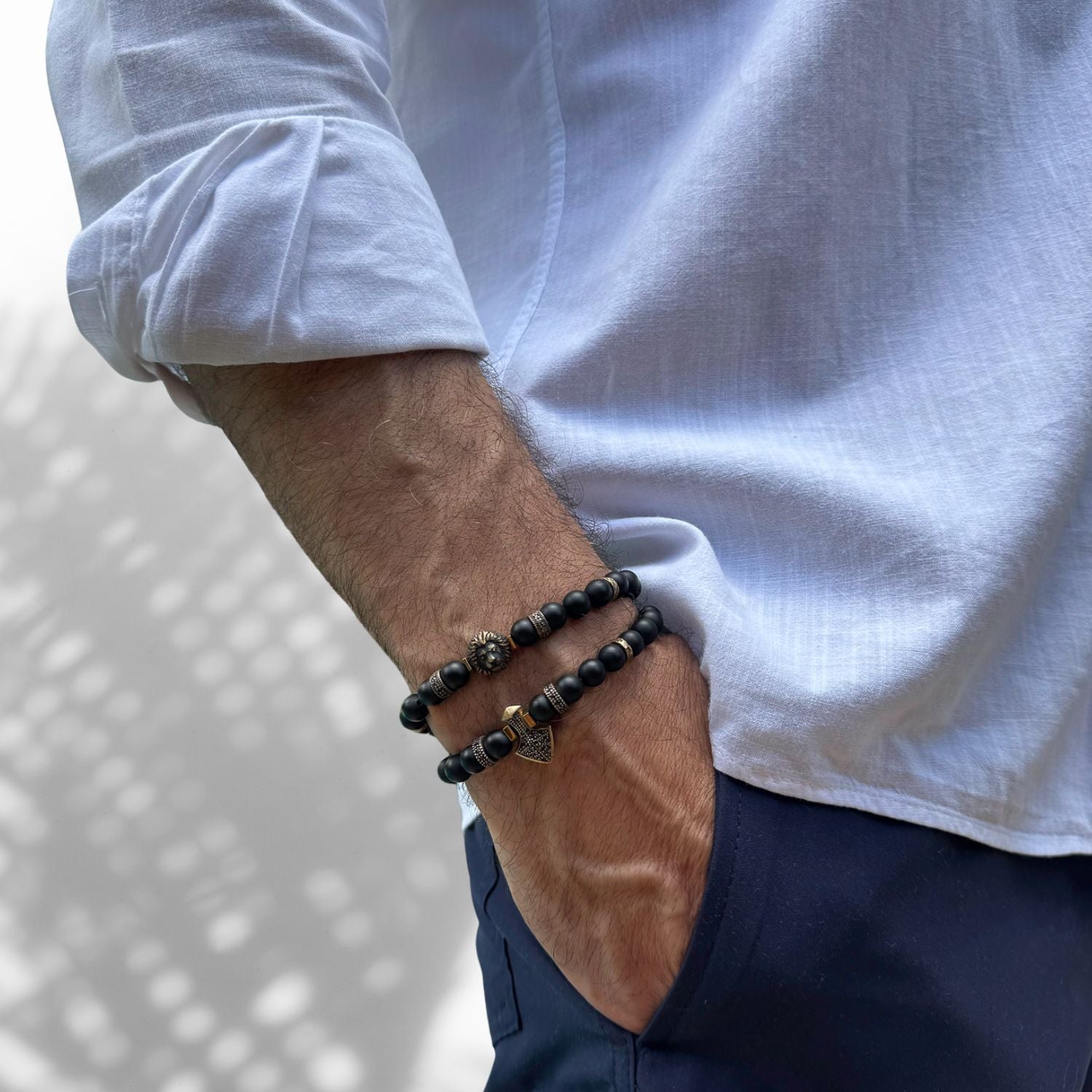 Men's Black Onyx Stone Bracelet Set with a striking bronze lion charm symbolizing courage and power