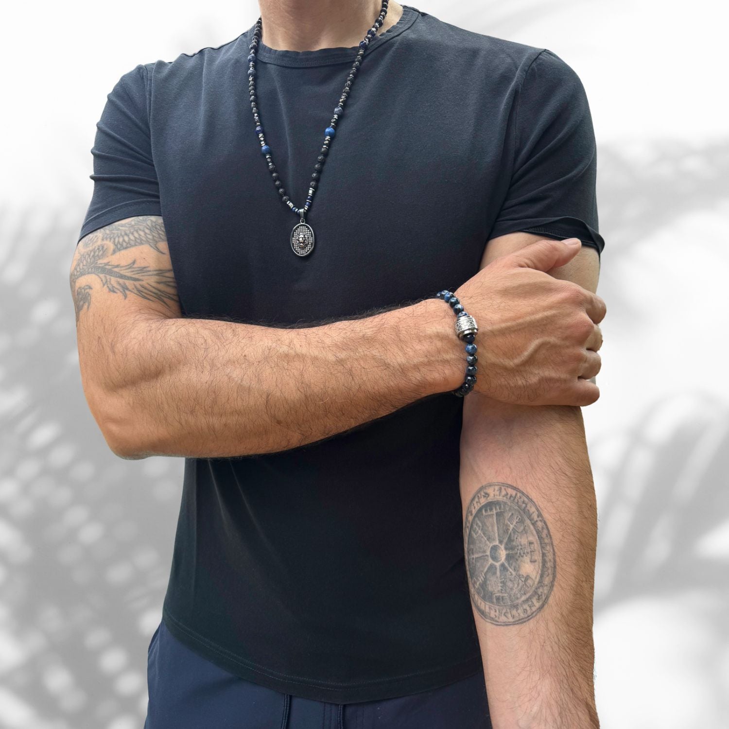 Black lava rock men's necklace with sterling silver lion pendant and lapis lazuli beads.