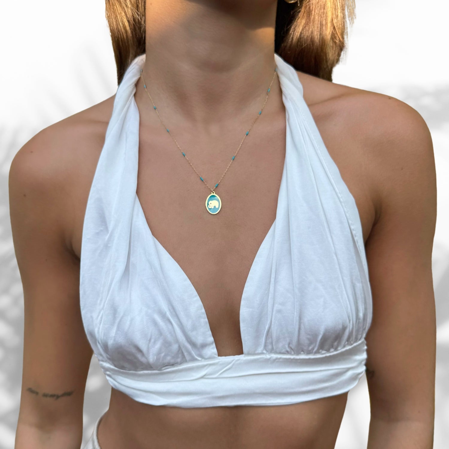 Model Wearing Handcrafted Elephant Pendant Necklace with Turquoise Enamel