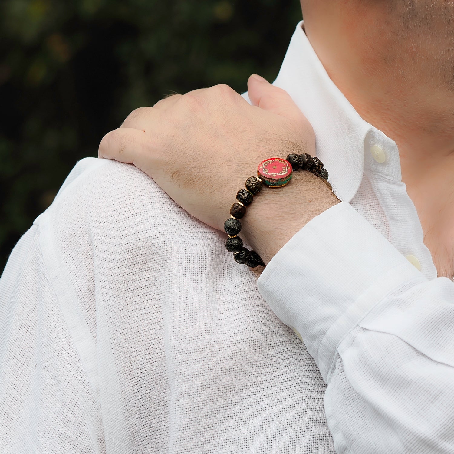 close up of prayer seed beads and lava rock on meditation bracelet