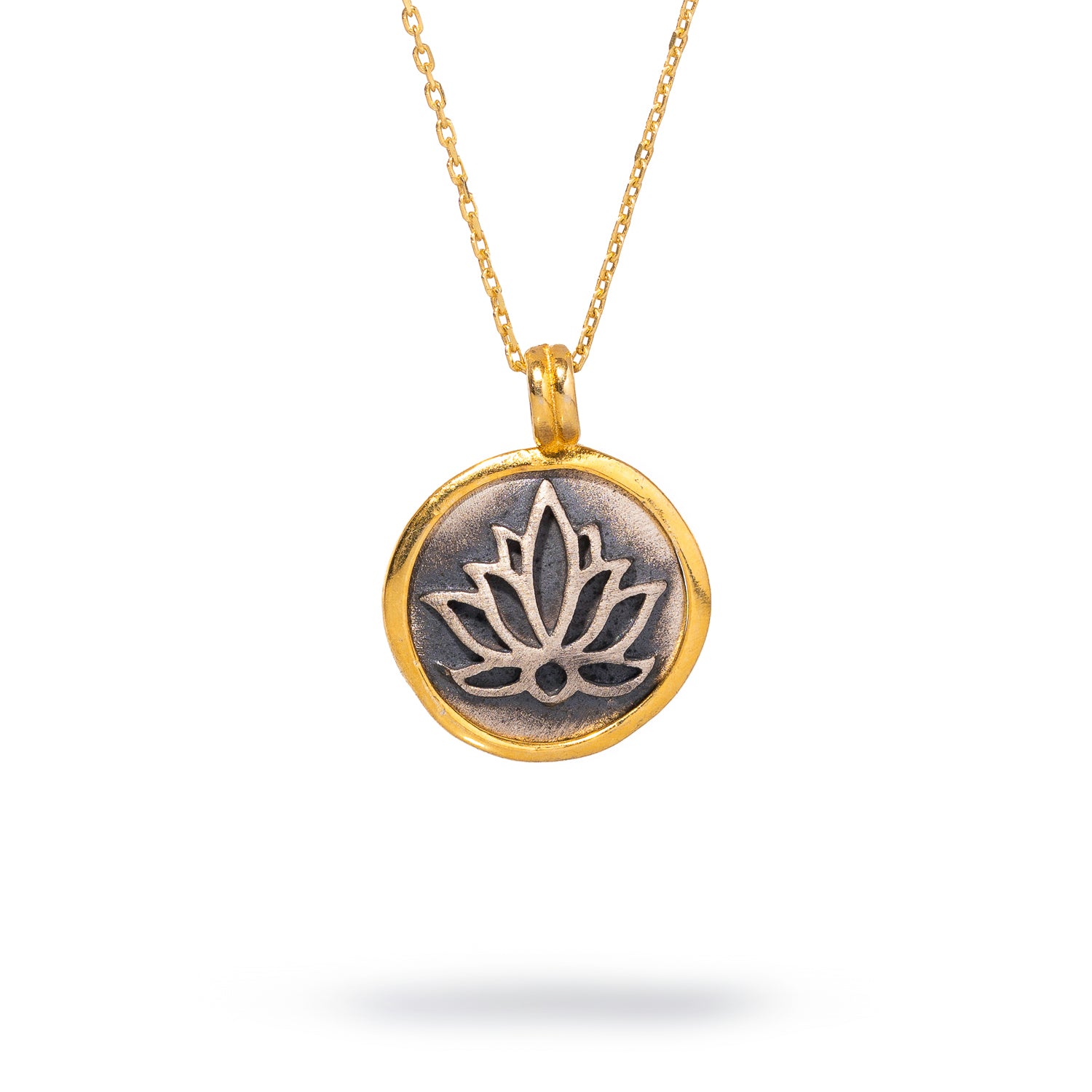 Delicate sterling silver necklace with a lotus flower pendant, adorned with 18k gold plating, symbolizing purity and spiritual growth.