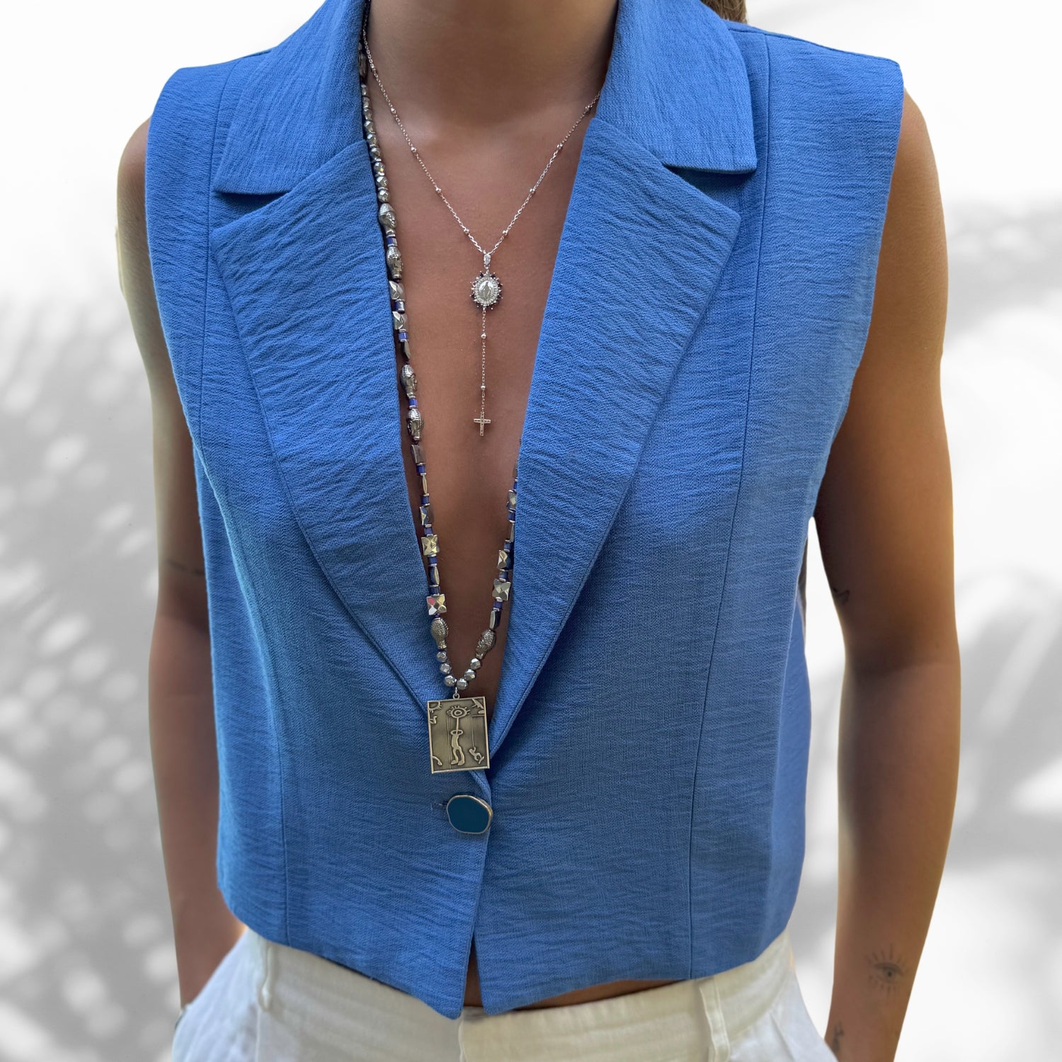 Model Wearing Meaningful Sapphire and Diamond Virgin Mary Necklace