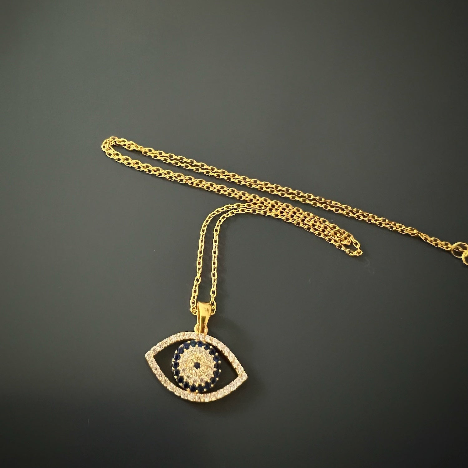 The Sparkly Evil Eye Necklace, a harmonious blend of sophistication and glamour.