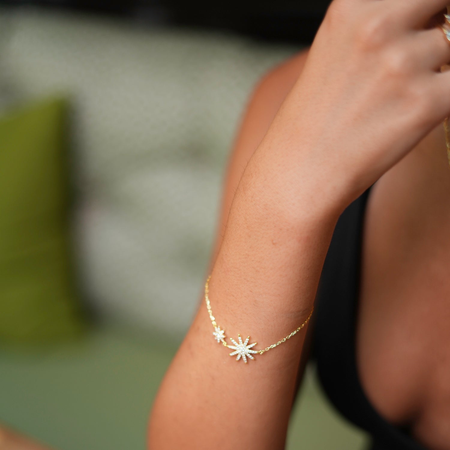 Delicate gold chain bracelet with star charms and sparkling diamonds, adjustable size for a customized fit.
