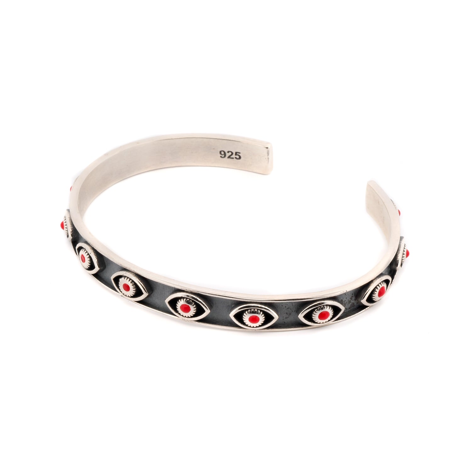 Sterling silver cuff bracelet with intricate coral evil eye accents