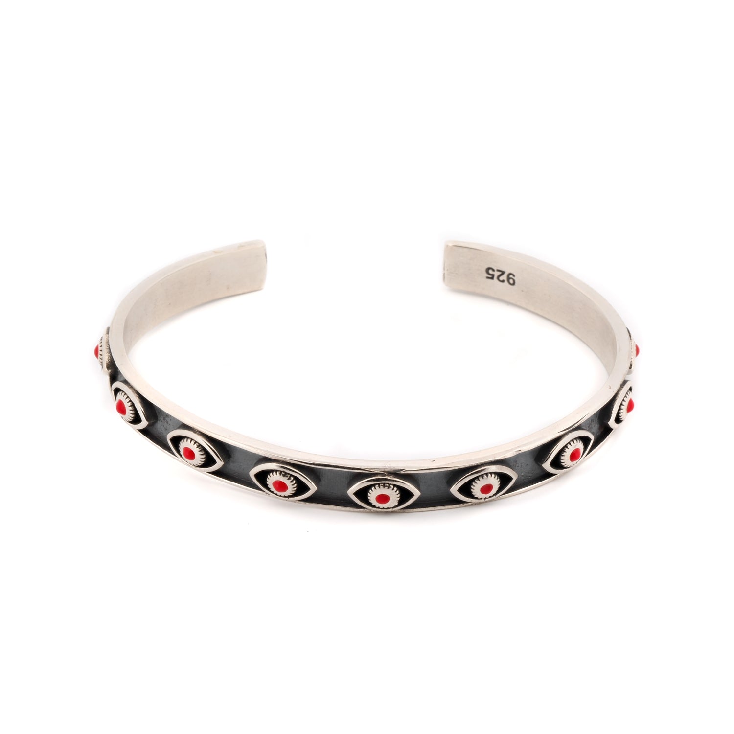 Sterling silver cuff bracelet with coral evil eye motifs