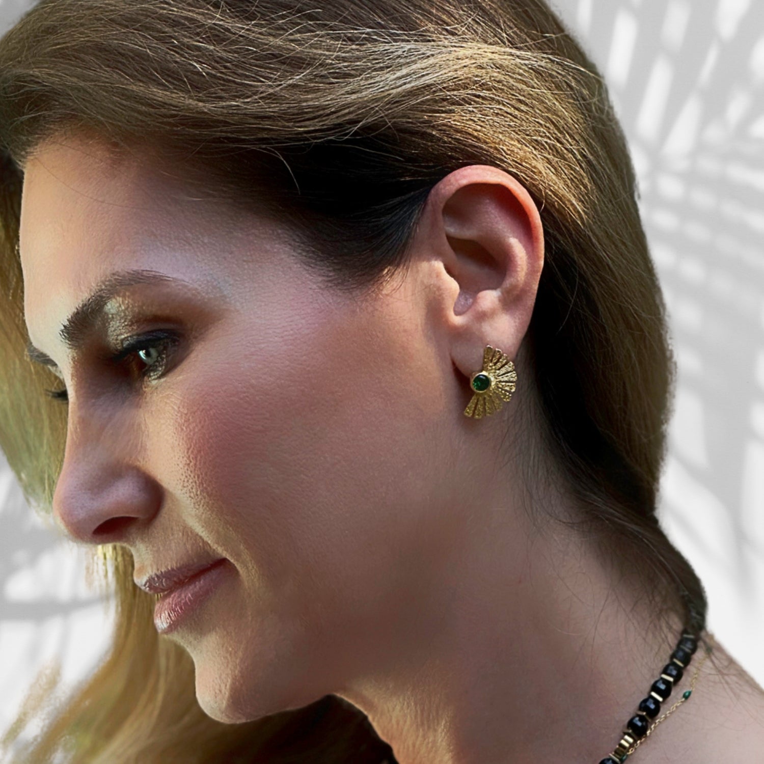 Regal sterling silver earrings plated with 18K gold and adorned with jade gemstones