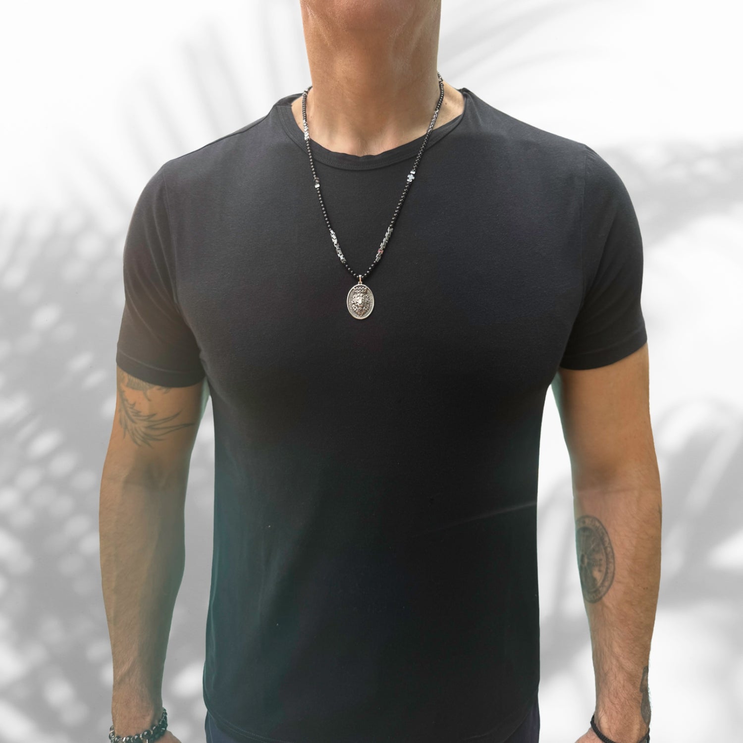 Handcrafted men's necklace with grounding black hematite beads and a 925 sterling silver lion pendant.