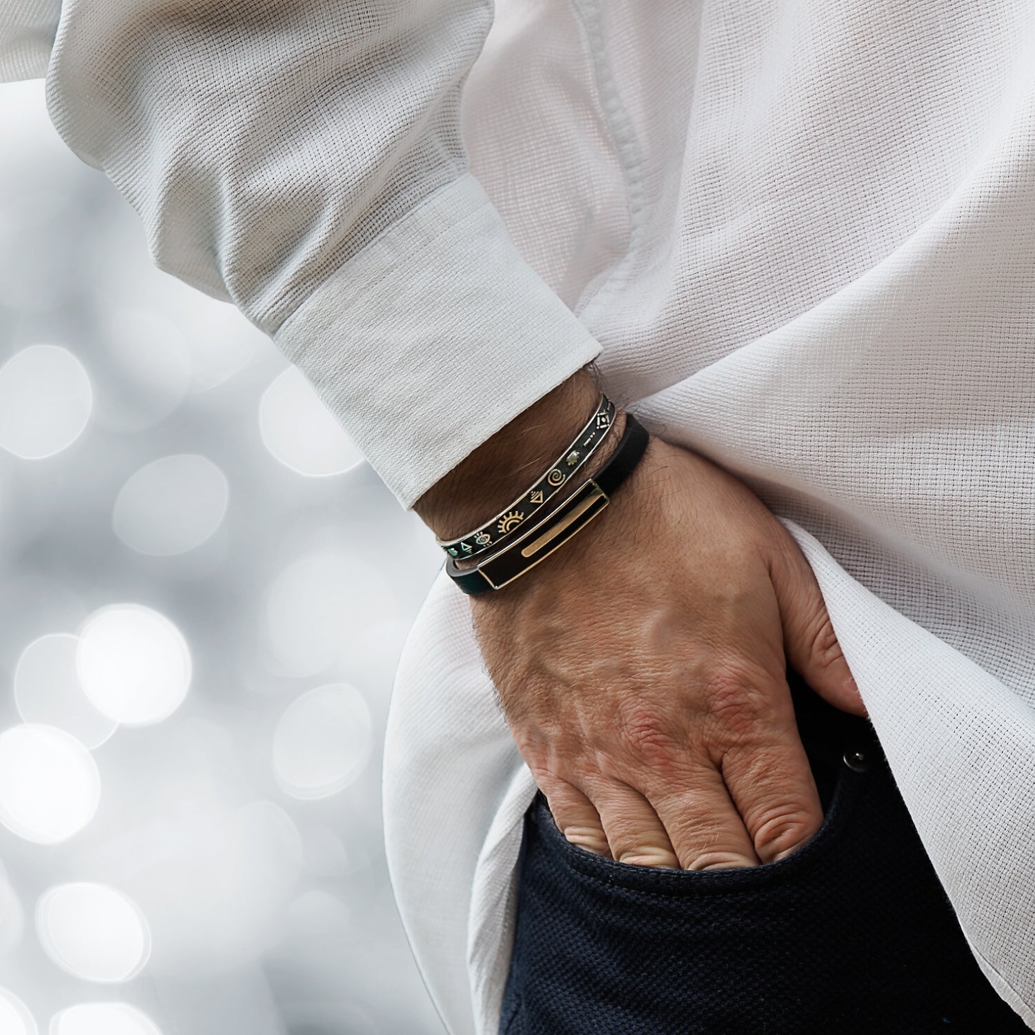 Unisex silver cuff bracelet featuring intricate spiritual icons