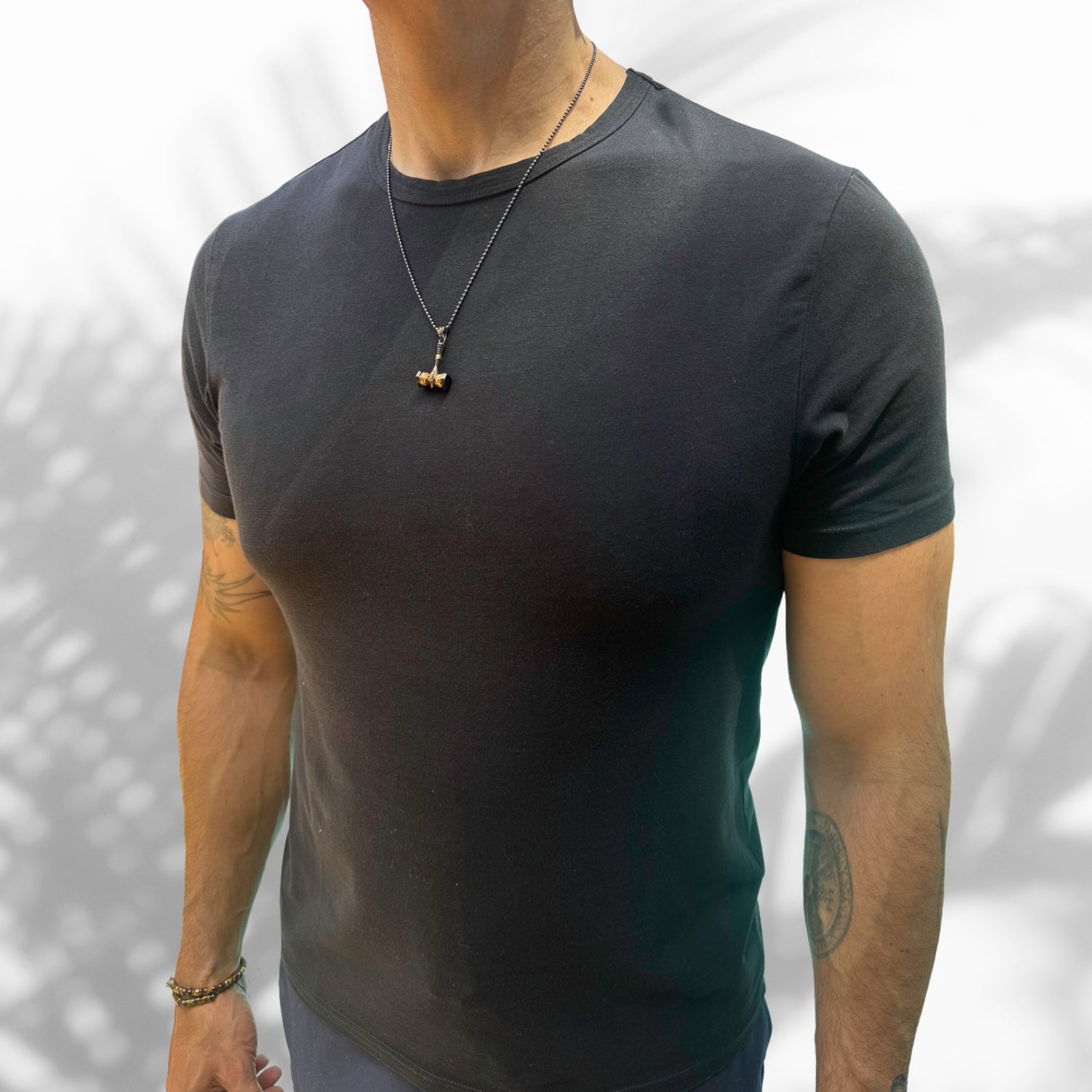 Men's Sterling Silver Necklace with a 24k gold-plated hammer pendant, symbolizing strength and resilience