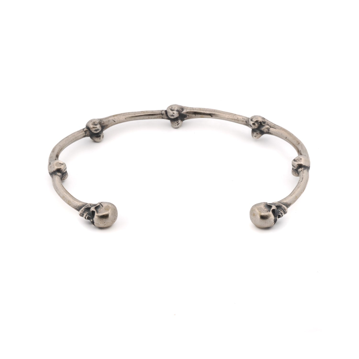 Unisex sterling silver cuff bracelet with a bold skull design