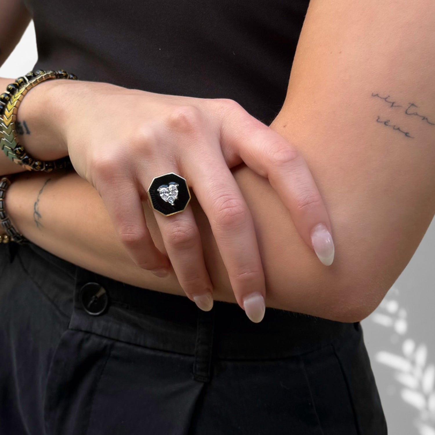 A Token of Love: Model Wearing Black Enamel Diamond Heart Gold Ring