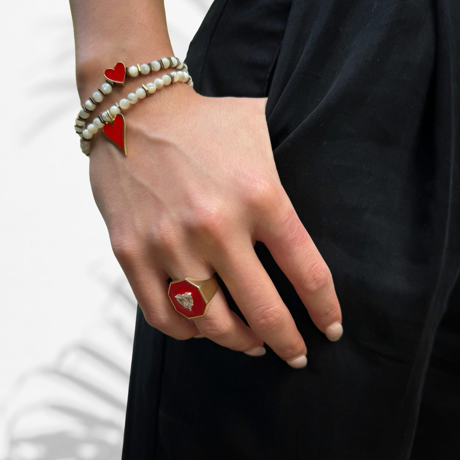Passionate Affection: Model Wearing Valentine's Red Enamel Heart Gold Ring with Diamond