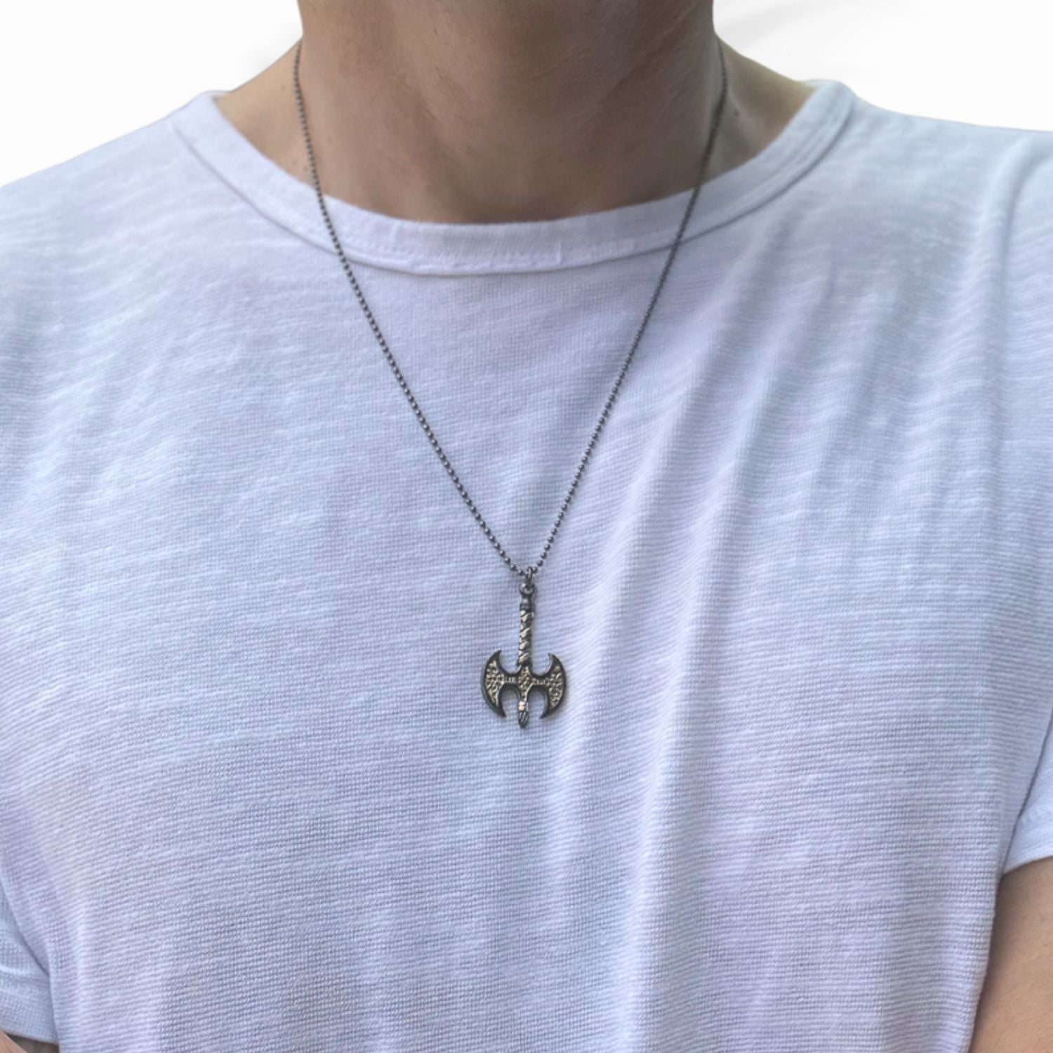 Norse-inspired men’s necklace with sterling silver and gold Viking axe pendant.