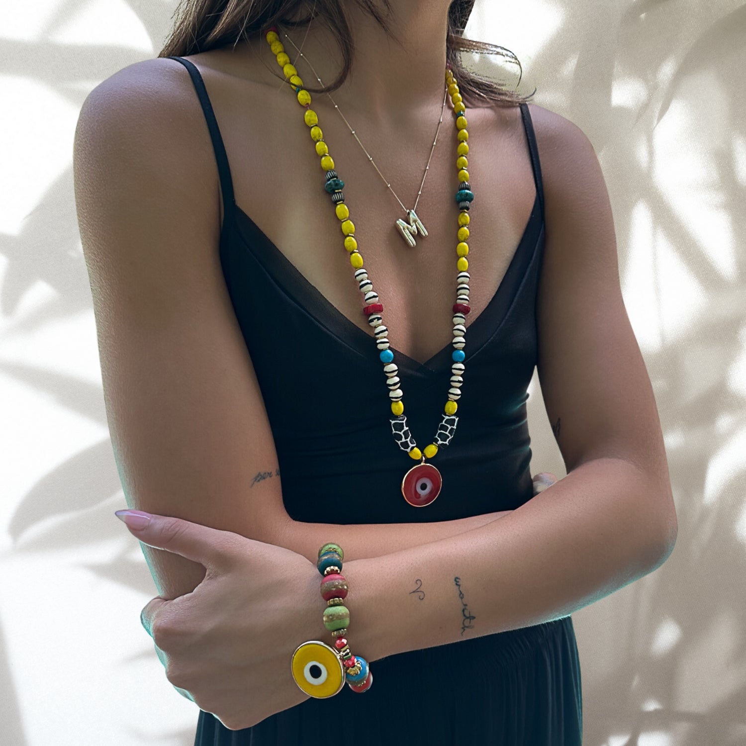 Model wearing the African Yellow Happiness Necklace, showcasing its vibrant colors and cultural significance.