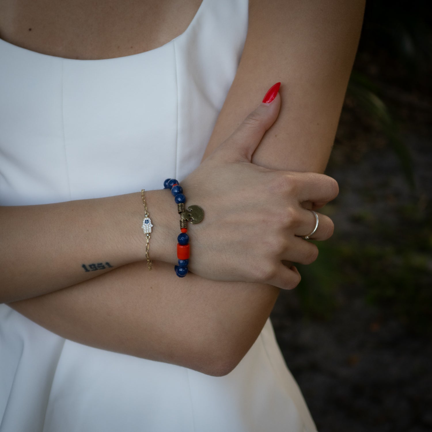Handmade Agate Stone and Bronze Charm Beaded Bracelet with bold blue and orange tones.