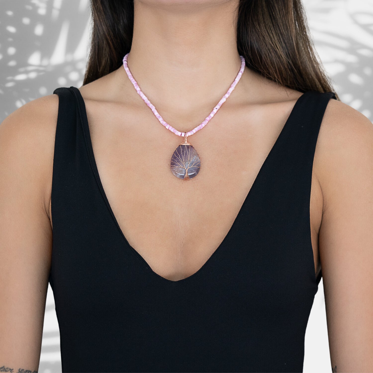 The model exudes grace and style while wearing the Amethyst Healing Tree Necklace, showcasing its elegant design and healing energy.