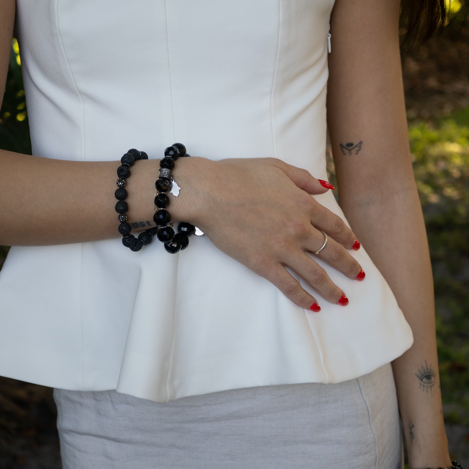 Elegant bracelet with earthy lava stones and sparkling Swarovski accent.